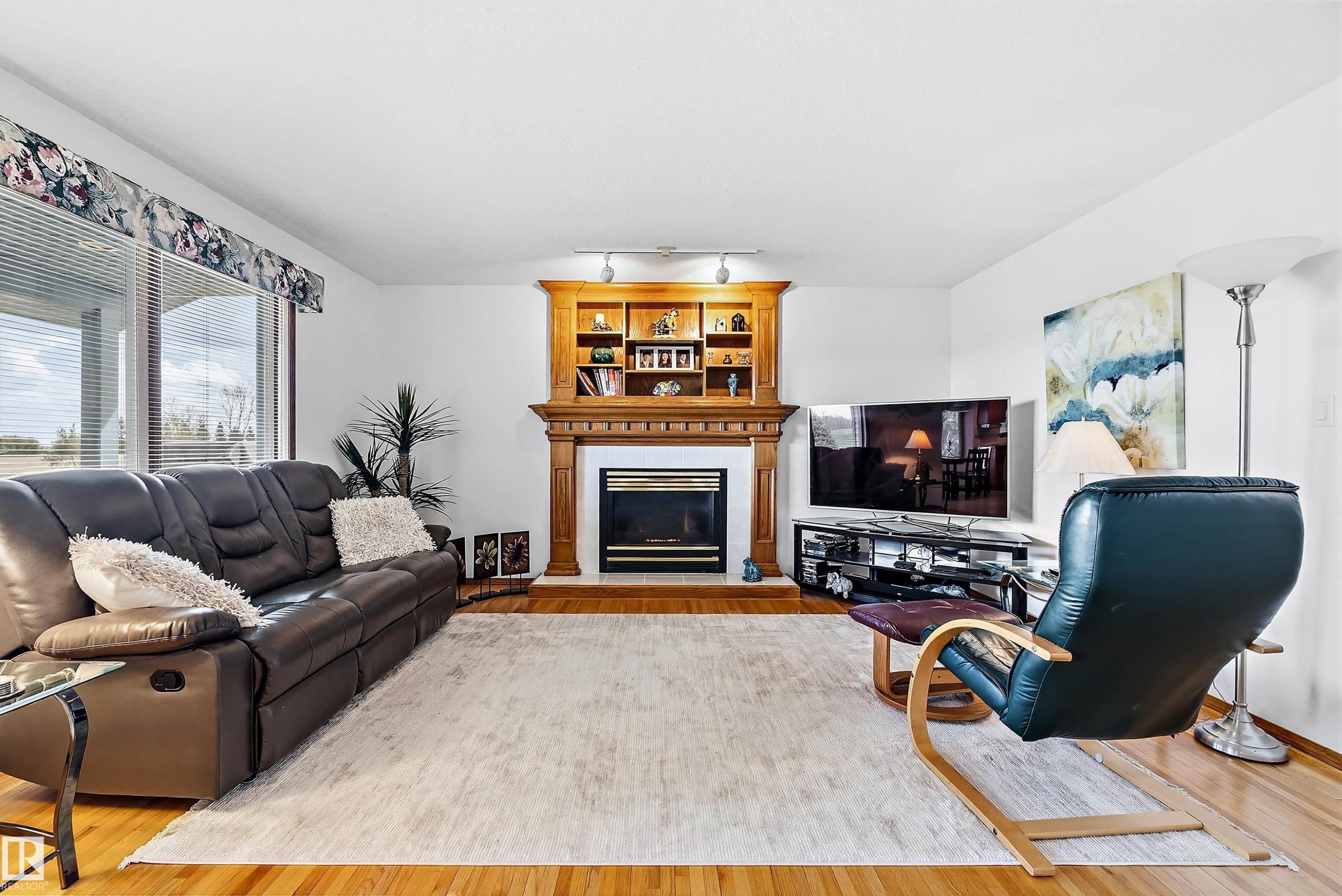 115 Aspen Ridge Crescent, Wetaskiwin, AB - Indoor Photo Showing Living Room With Fireplace