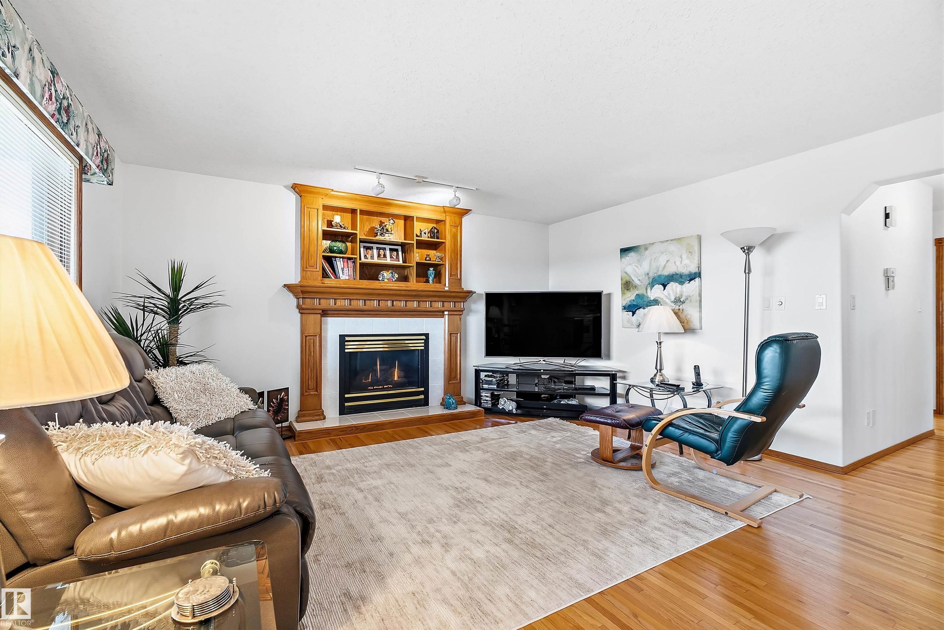 115 Aspen Ridge Crescent, Wetaskiwin, AB - Indoor Photo Showing Living Room With Fireplace
