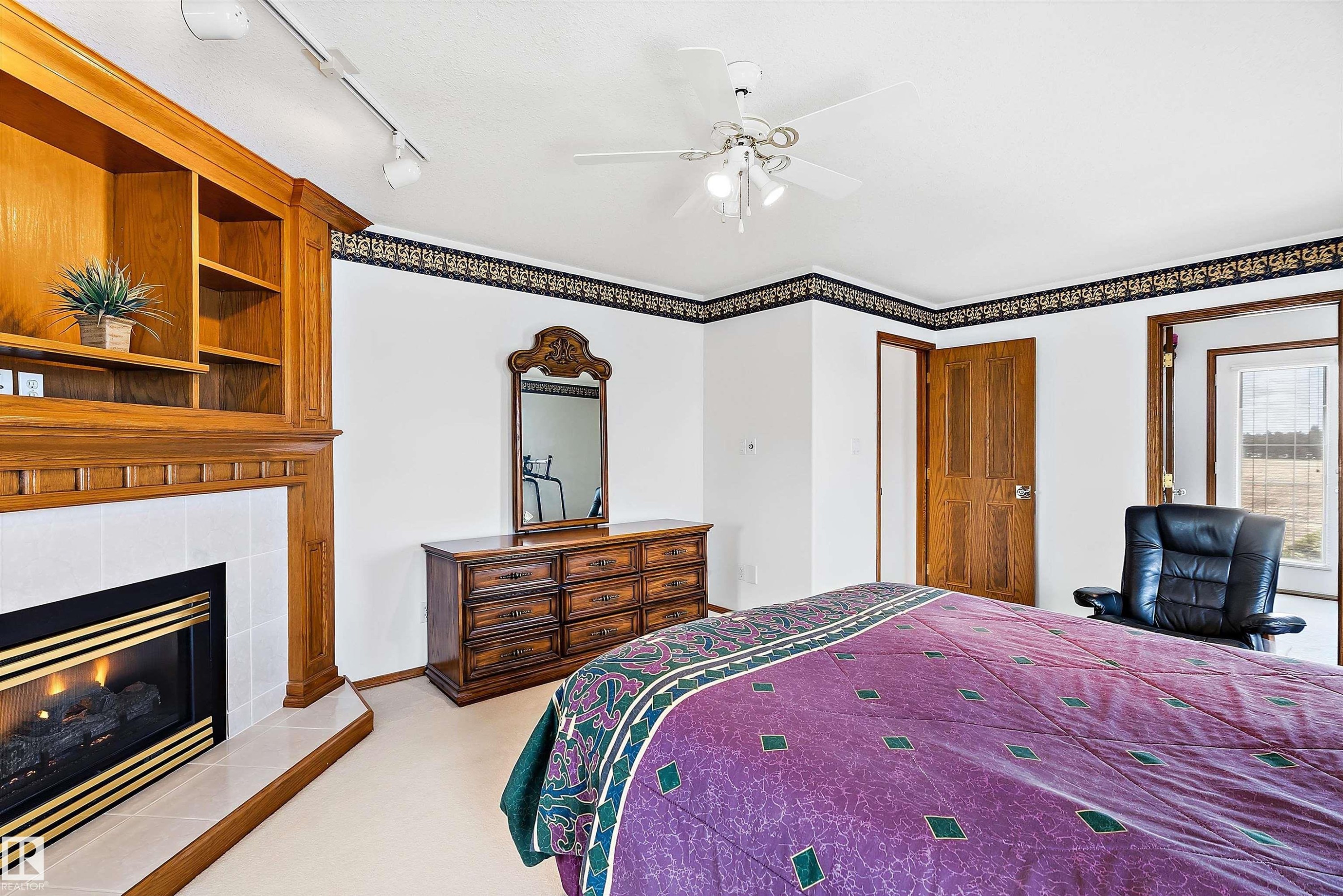 115 Aspen Ridge Crescent, Wetaskiwin, AB - Indoor Photo Showing Bedroom With Fireplace