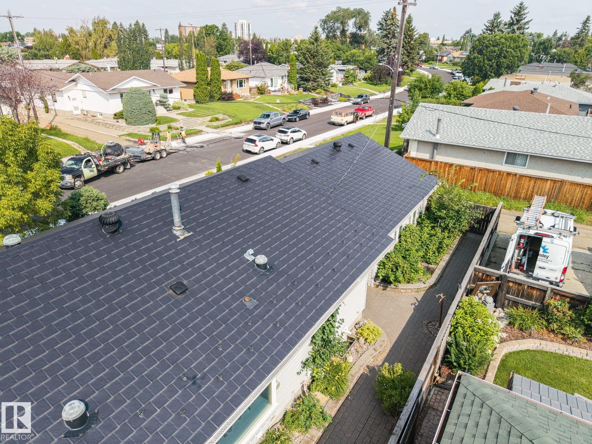 New architectural asphalt shingle roof with multiple roof penetrations and ventilation features - 9503 54 Street Nw, Edmonton, AB
