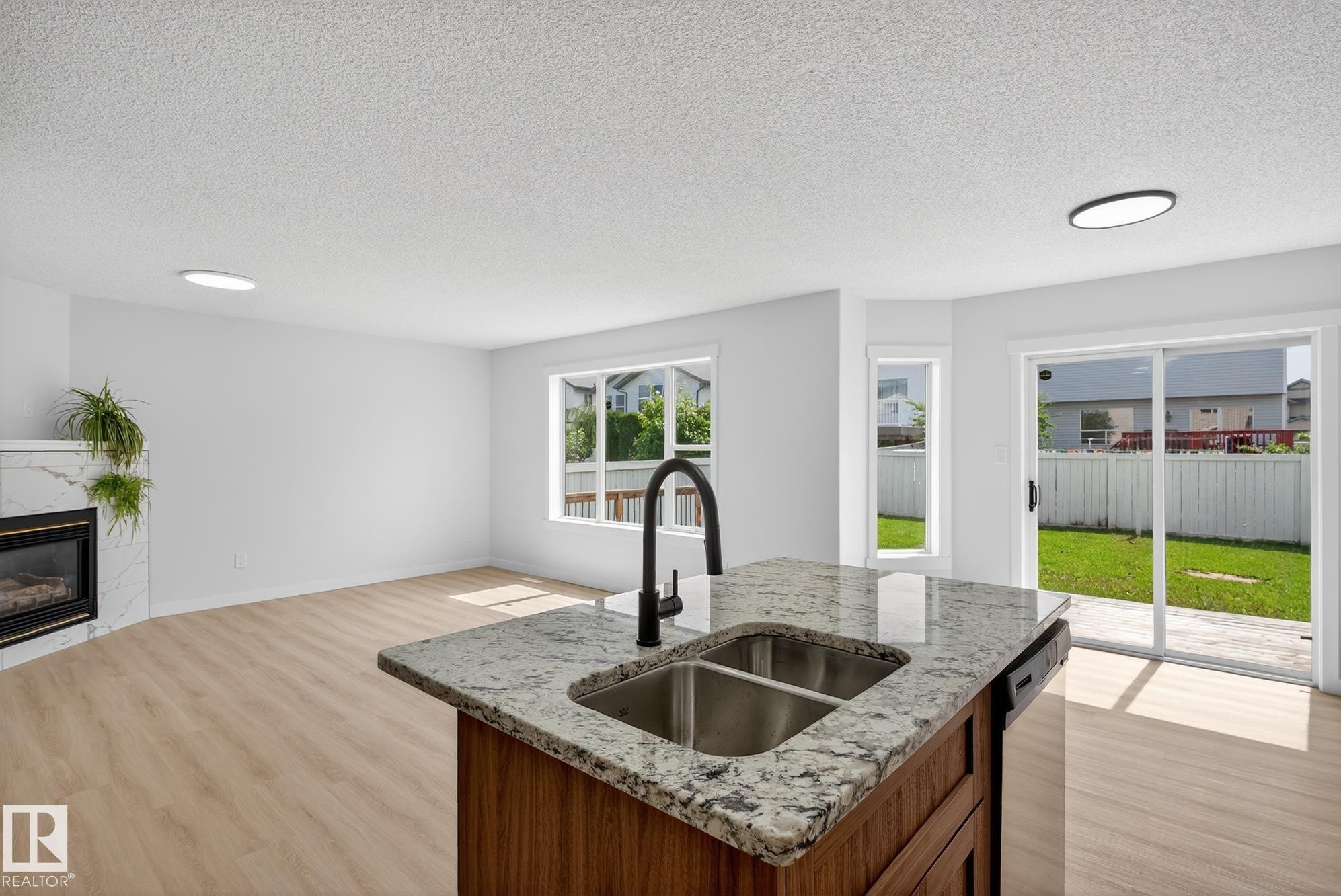 168 Ward Crescent Nw, Edmonton, AB - Indoor Photo Showing Kitchen With Fireplace With Double Sink