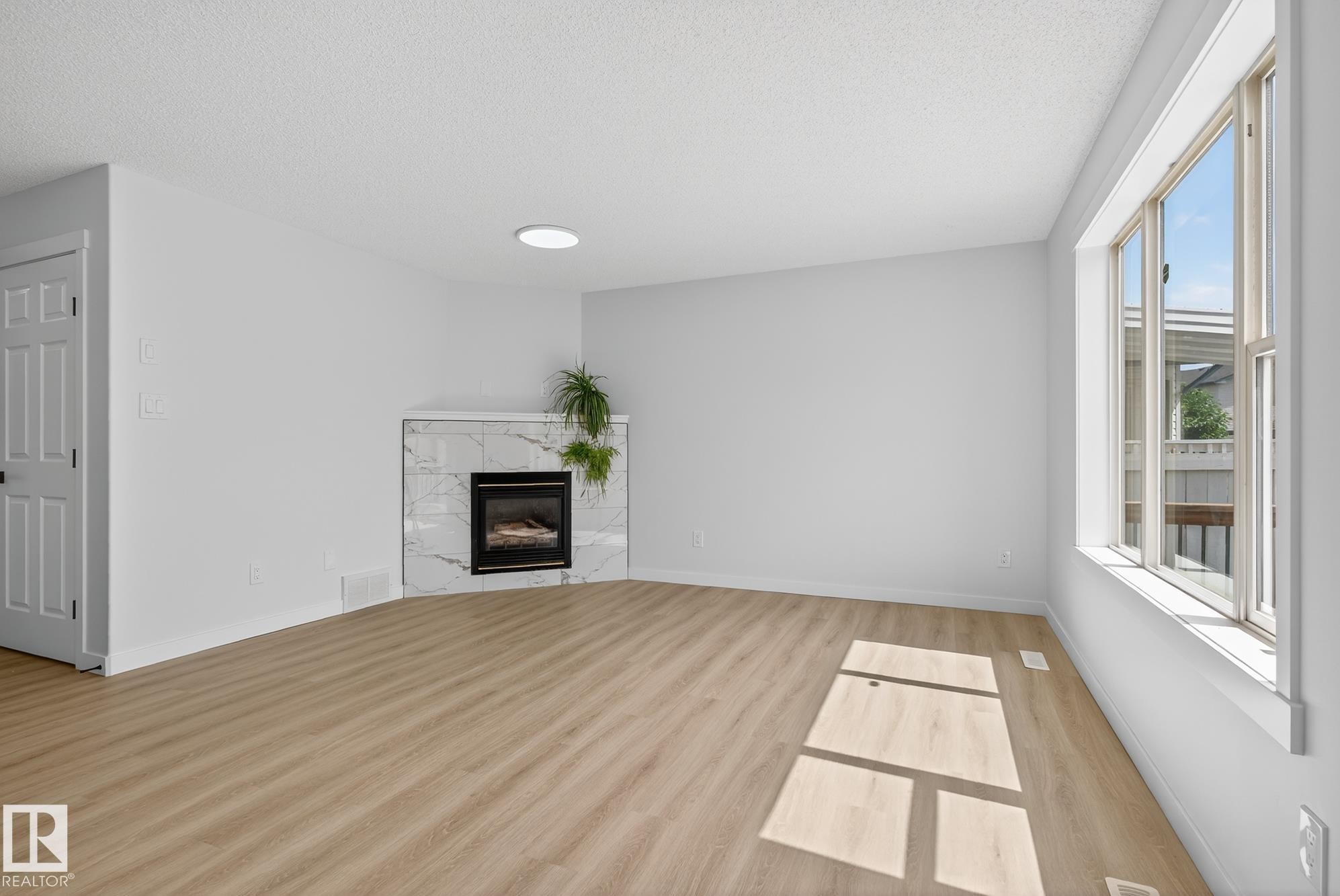 168 Ward Crescent Nw, Edmonton, AB - Indoor Photo Showing Other Room With Fireplace