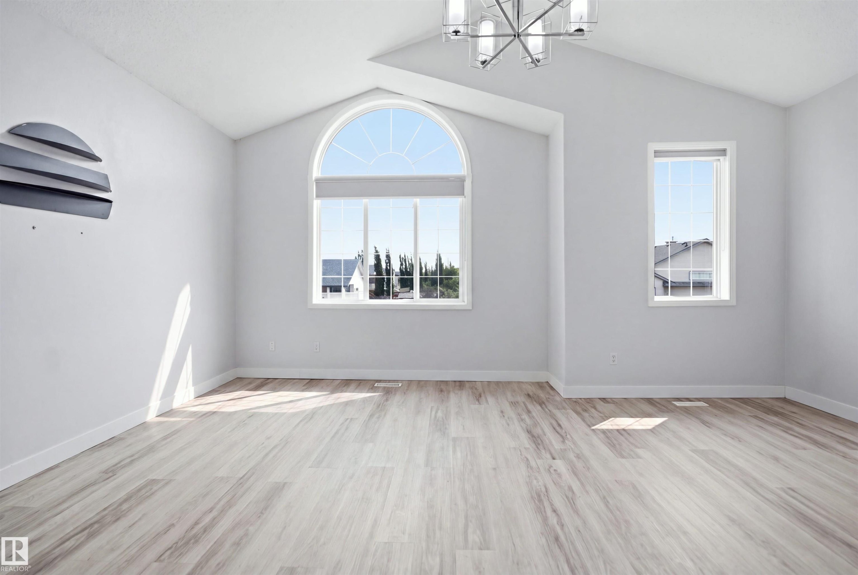 Vaulted ceilings featuring a contemporary chandelier - 714 87 Street Sw, Edmonton, AB - Indoor Photo Showing Other Room