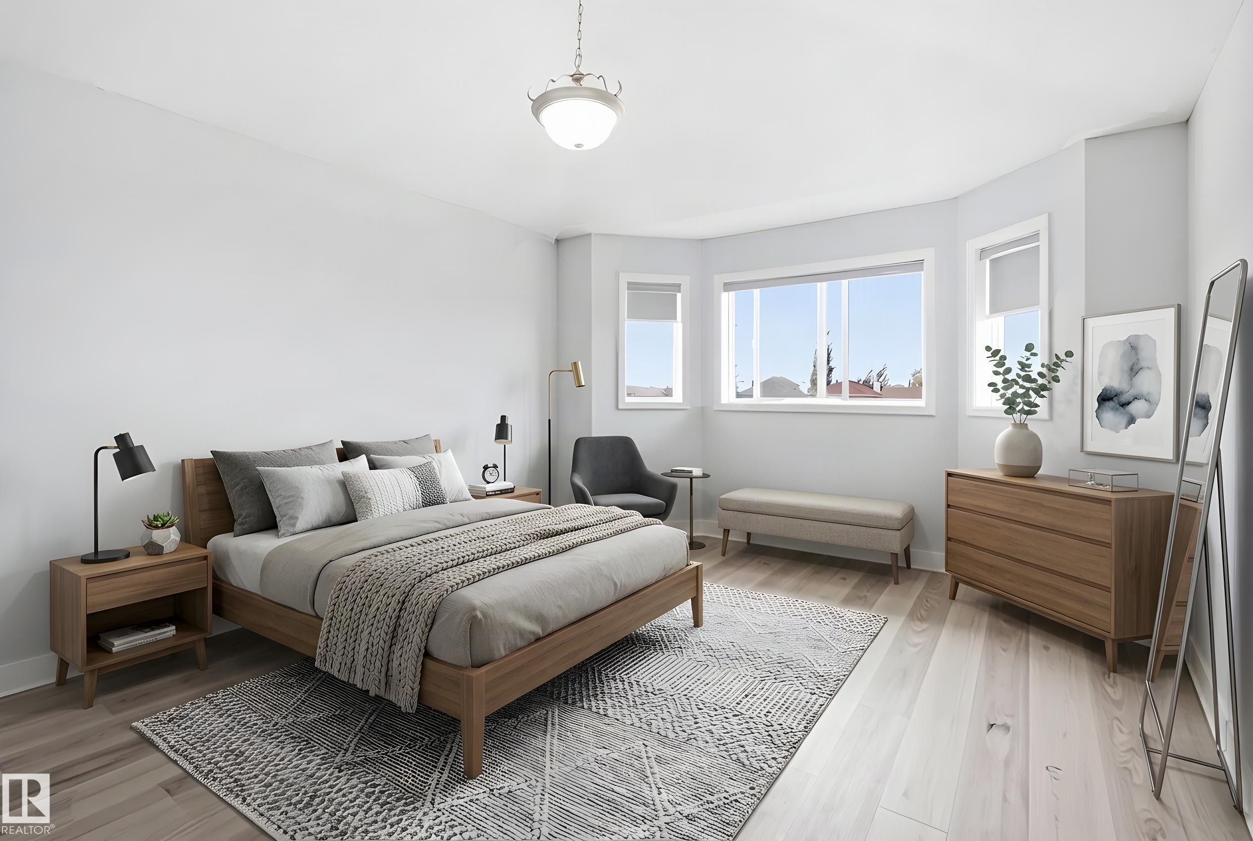 Spacious bedroom featuring light wood-finish flooring, a bay window with multiple panes, and a semi-flush mount ceiling light fixture - 714 87 Street Sw, Edmonton, AB - Indoor Photo Showing Bedroom