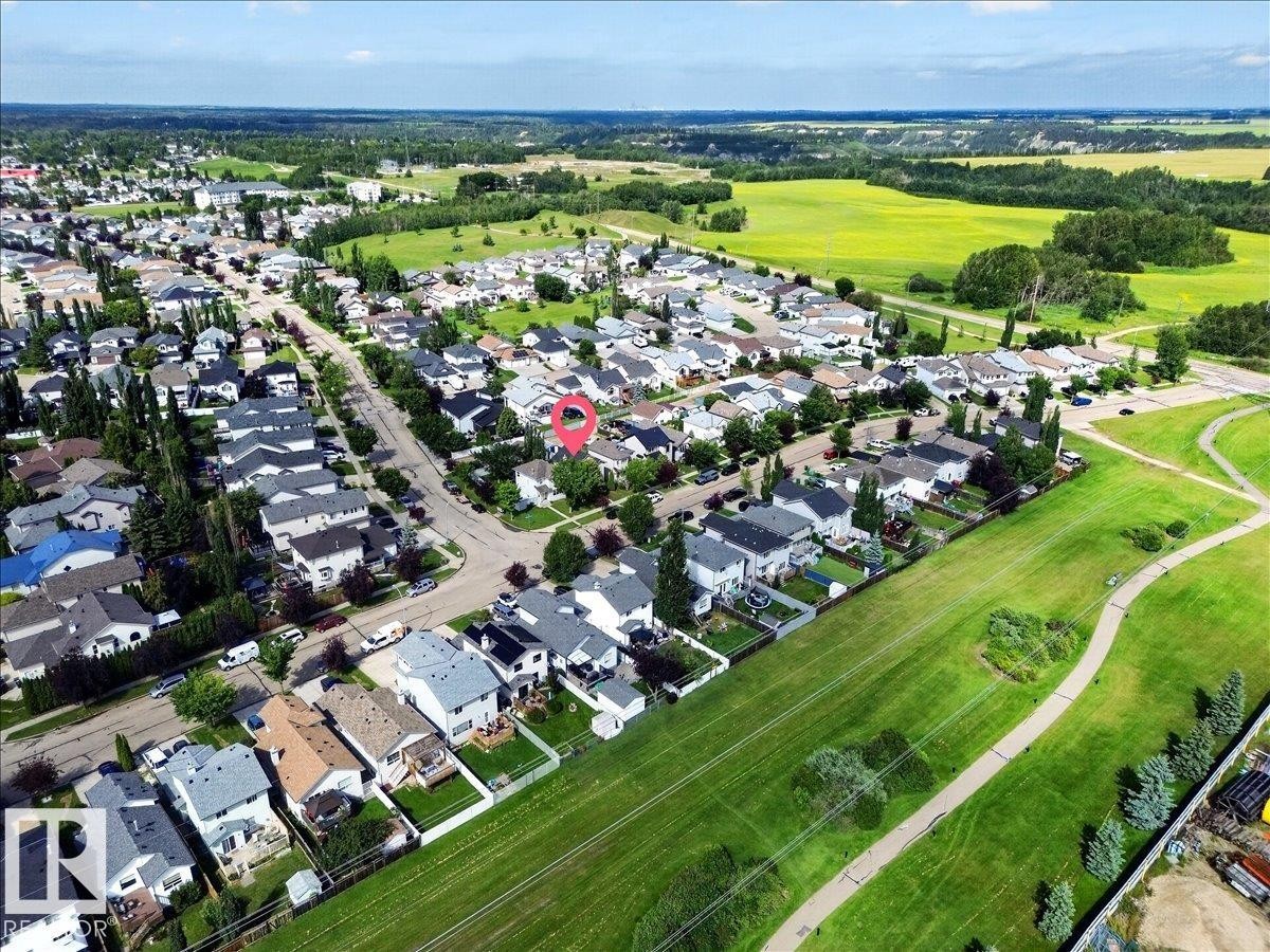 Established neighborhood with a residential street, ample green space, and extensive tree coverage - 887 Oakland Boulevard, Devon, AB - Outdoor With View