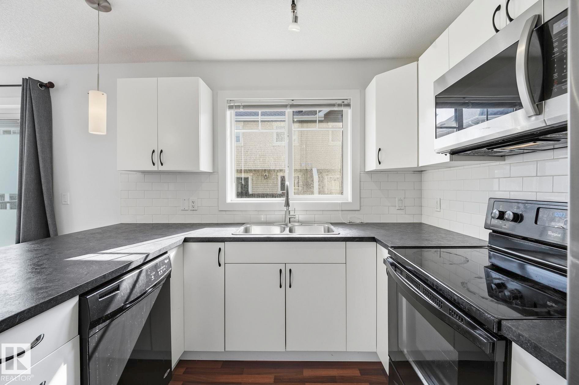 #18 13810 166 Av Nw, Edmonton, AB - Indoor Photo Showing Kitchen With Double Sink