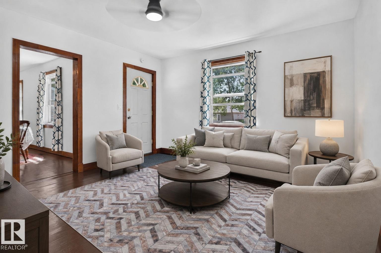 Hardwood flooring, recessed lighting, and a ceiling fan create a comfortable atmosphere - 9921 109 Street, Fort Saskatchewan, AB - Indoor Photo Showing Living Room