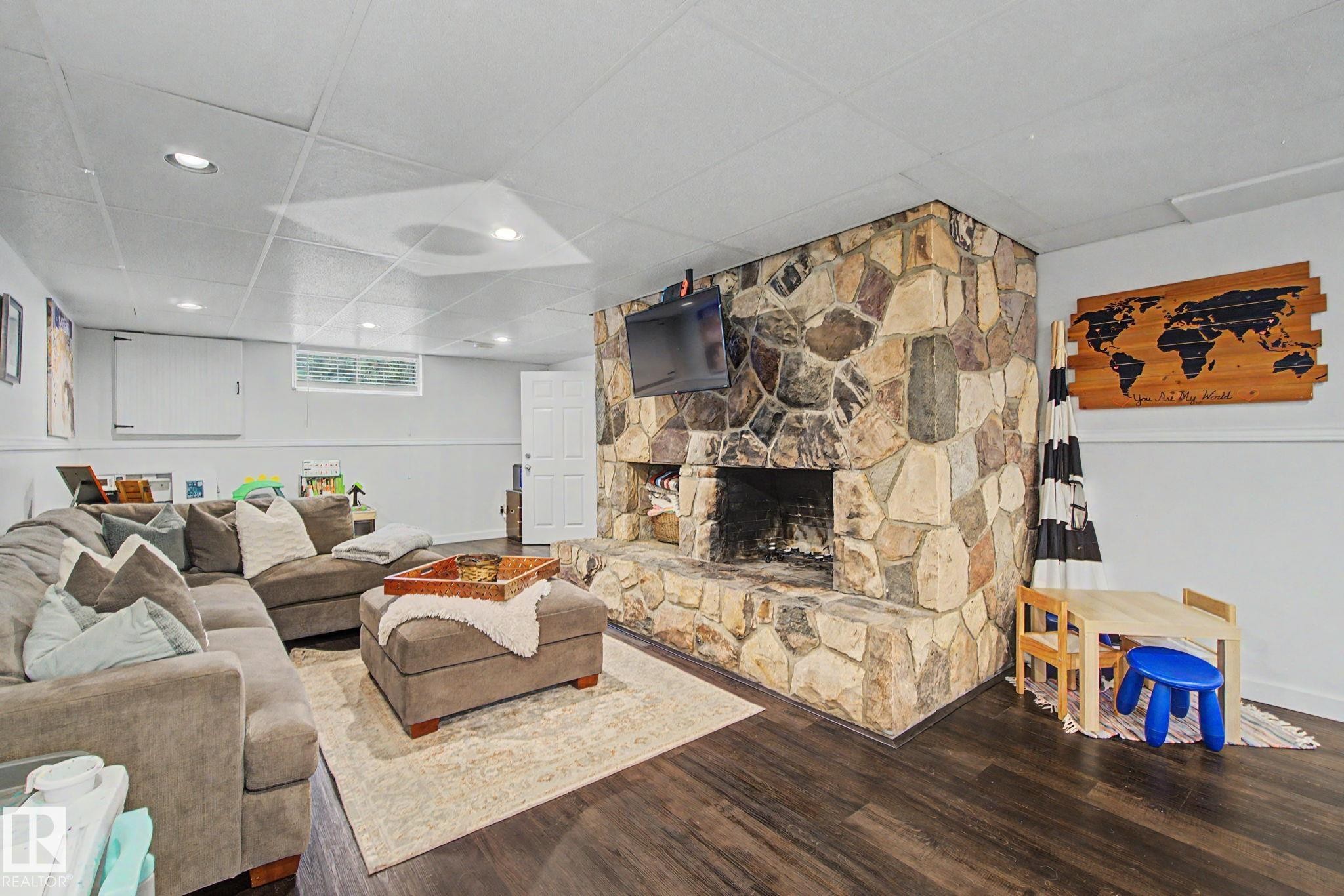 7712 159 Street Nw, Edmonton, AB - Indoor Photo Showing Living Room With Fireplace