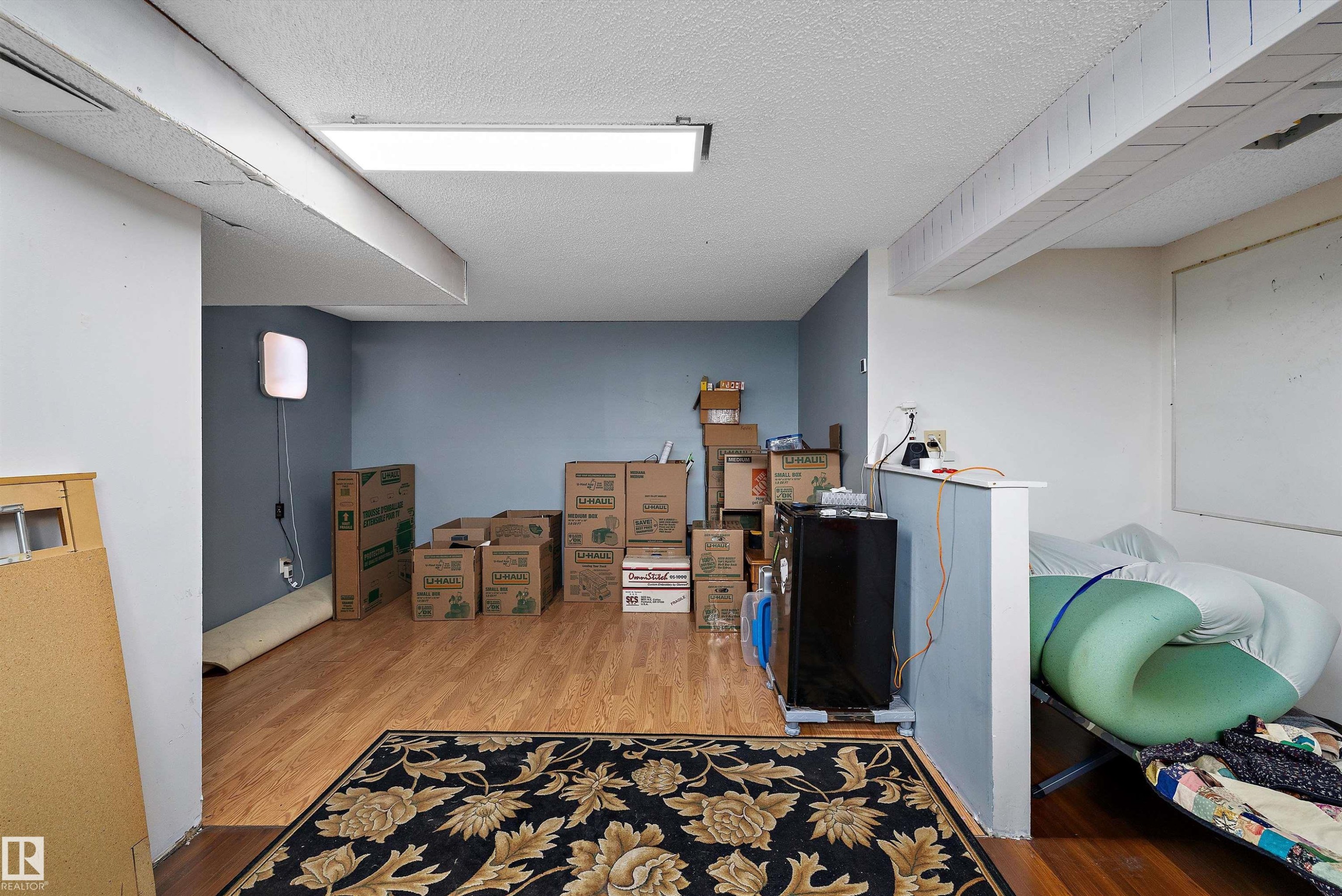 Wood-finish flooring with recessed ceiling lighting - 3511 73 Street Nw, Edmonton, AB - Indoor Photo Showing Other Room