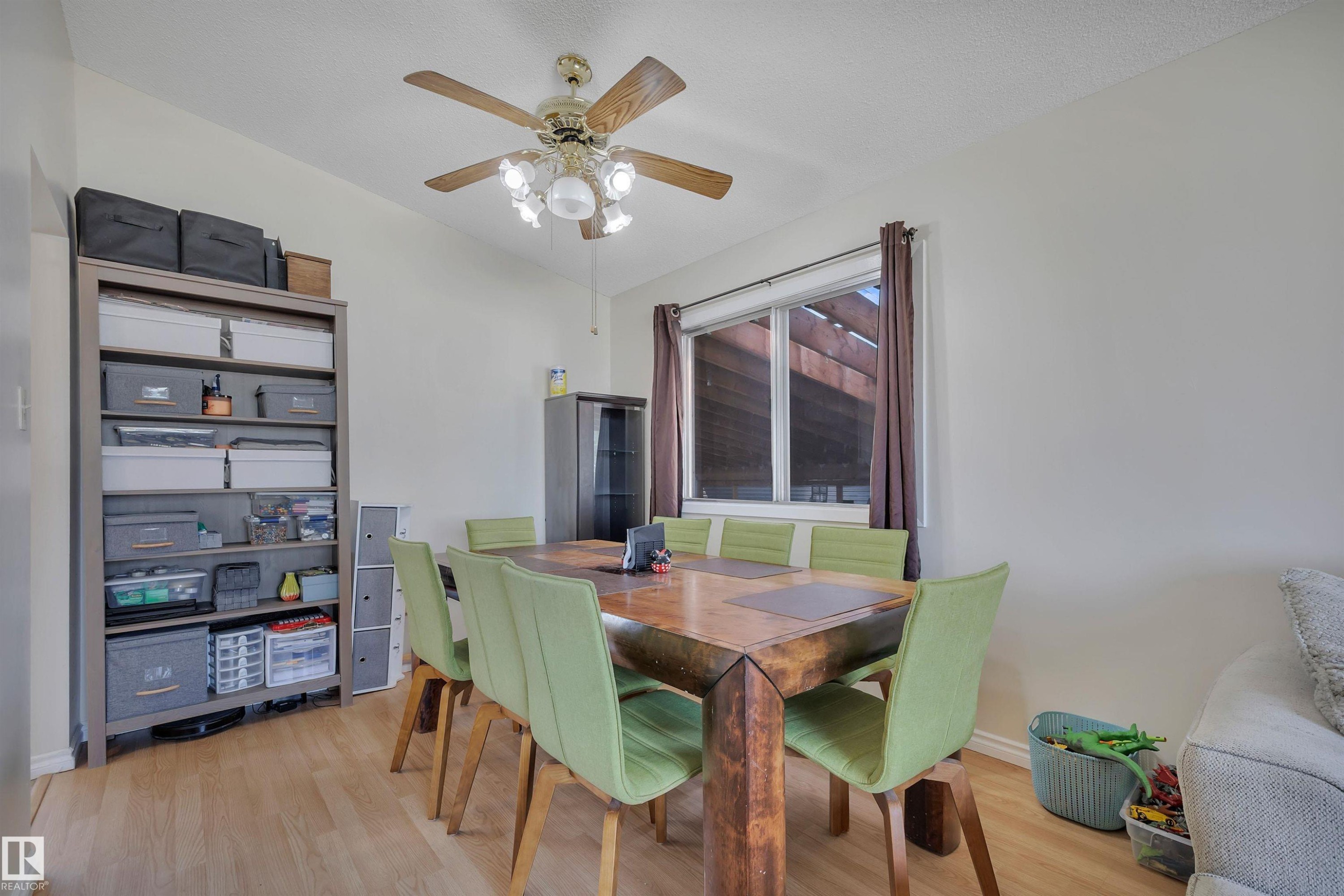 Wood-finish flooring throughout - 5411 44 Ave, Wetaskiwin, AB - Indoor Photo Showing Dining Room