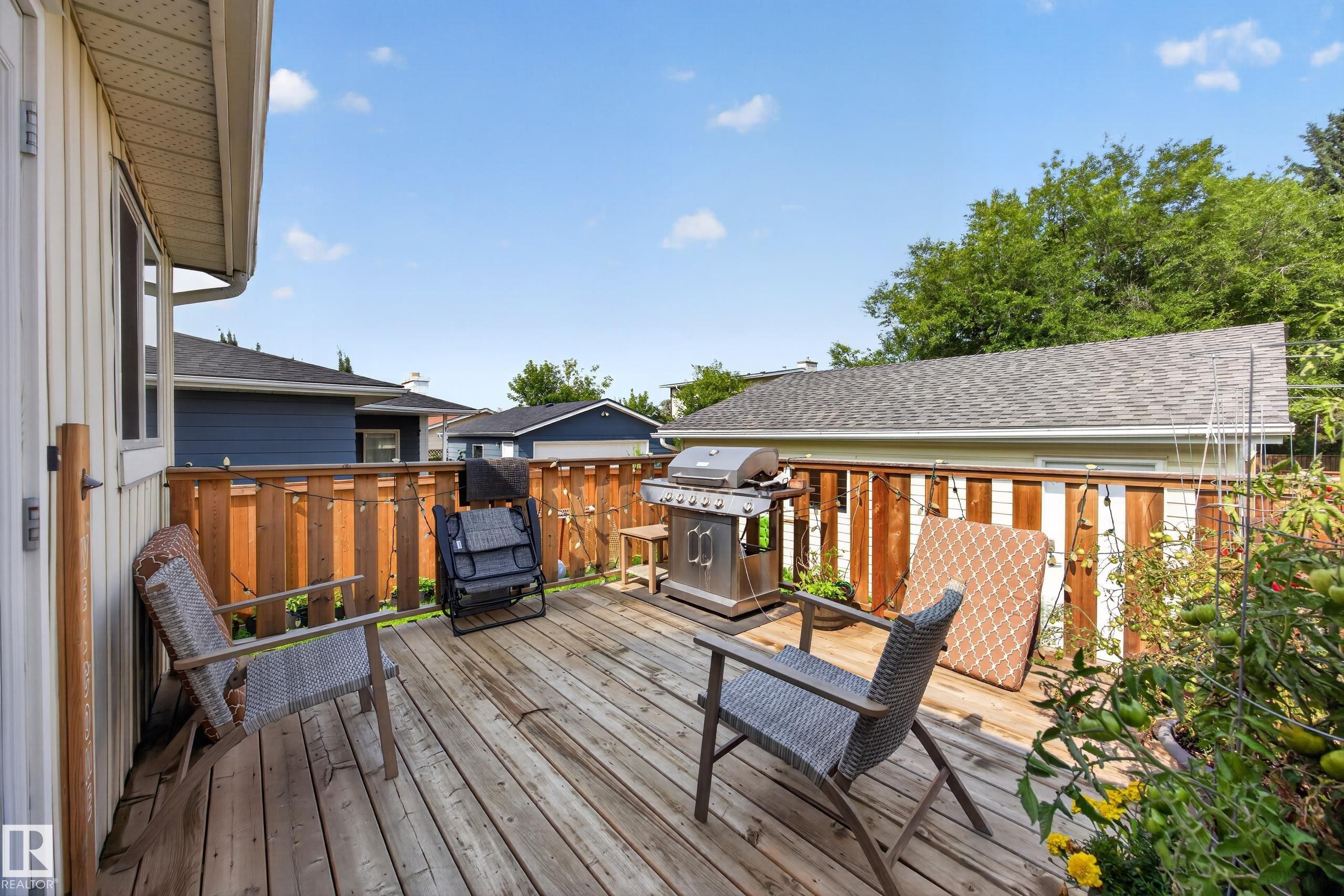 Spacious wood deck with a privacy fence and garden area - 156 Clareview Road Nw, Edmonton, AB - Outdoor With Deck Patio Veranda With Exterior
