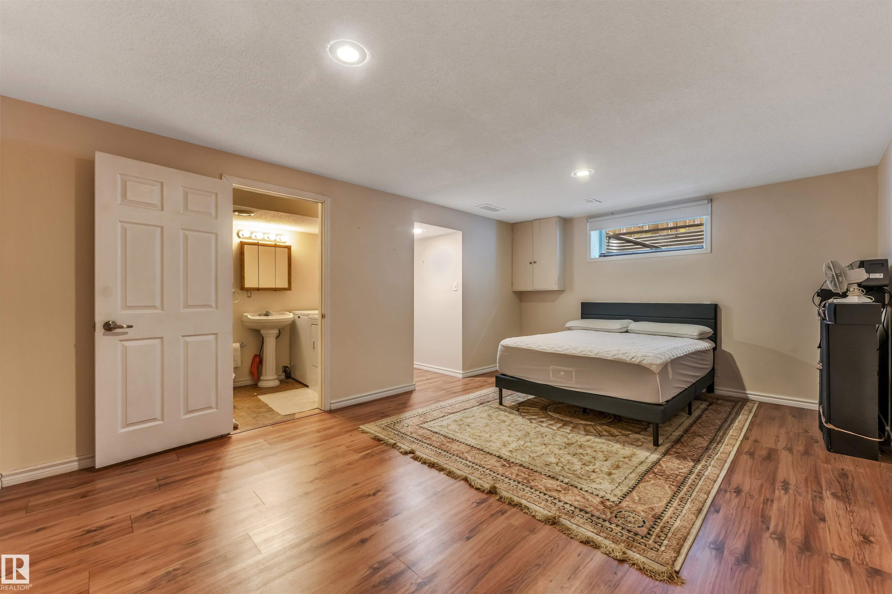 Wood-finish flooring, recessed lighting, and a window with blinds - 3032 31 Avenue Nw, Edmonton, AB - Indoor