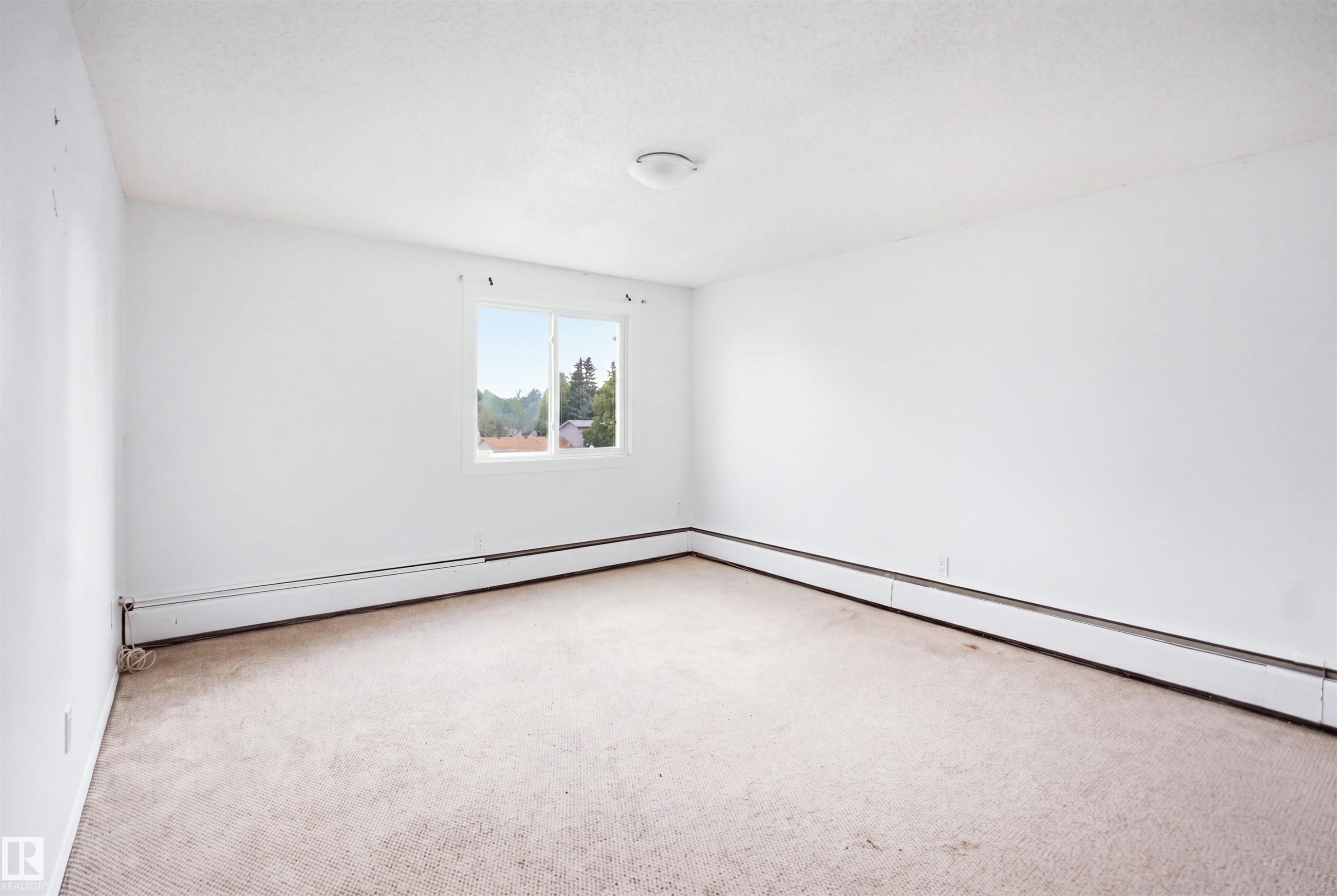 Carpet flooring, white walls, windows, and ceiling-mounted lighting - 7825 159 Street Nw, Edmonton, AB - Indoor Photo Showing Other Room