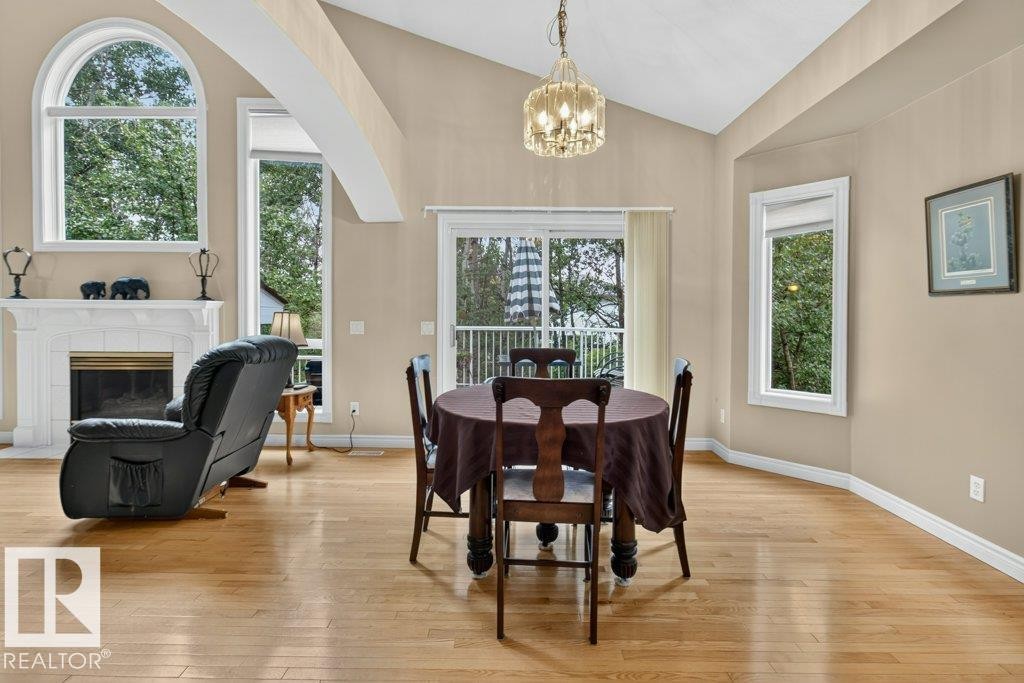 925 Burrows Crescent Nw, Edmonton, AB - Indoor Photo Showing Dining Room With Fireplace