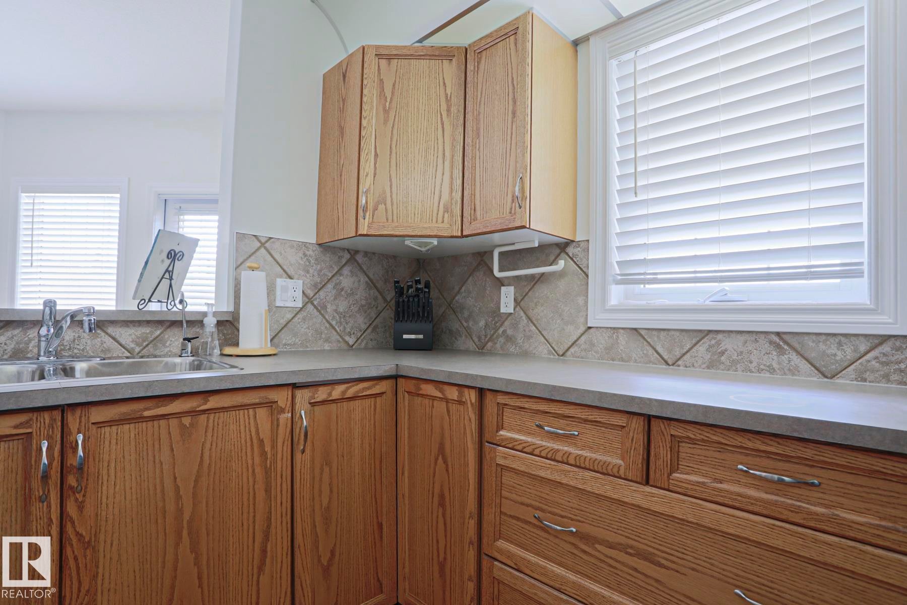 #131 11260 153 Av Nw, Edmonton, AB - Indoor Photo Showing Kitchen With Double Sink