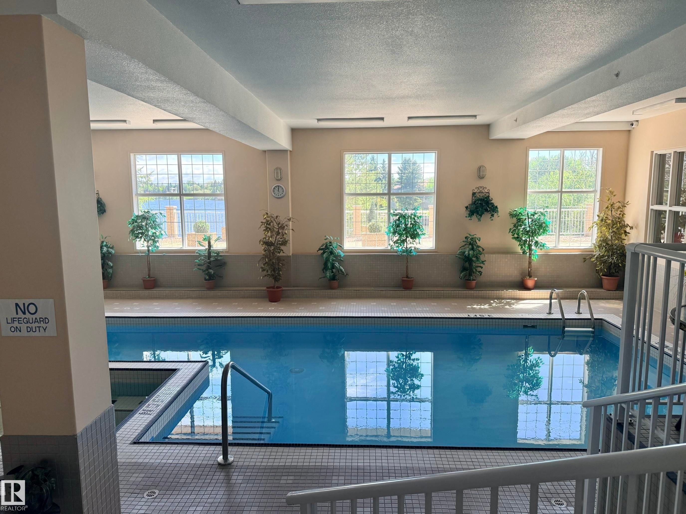 #131 11260 153 Av Nw, Edmonton, AB - Indoor Photo Showing Other Room With In Ground Pool