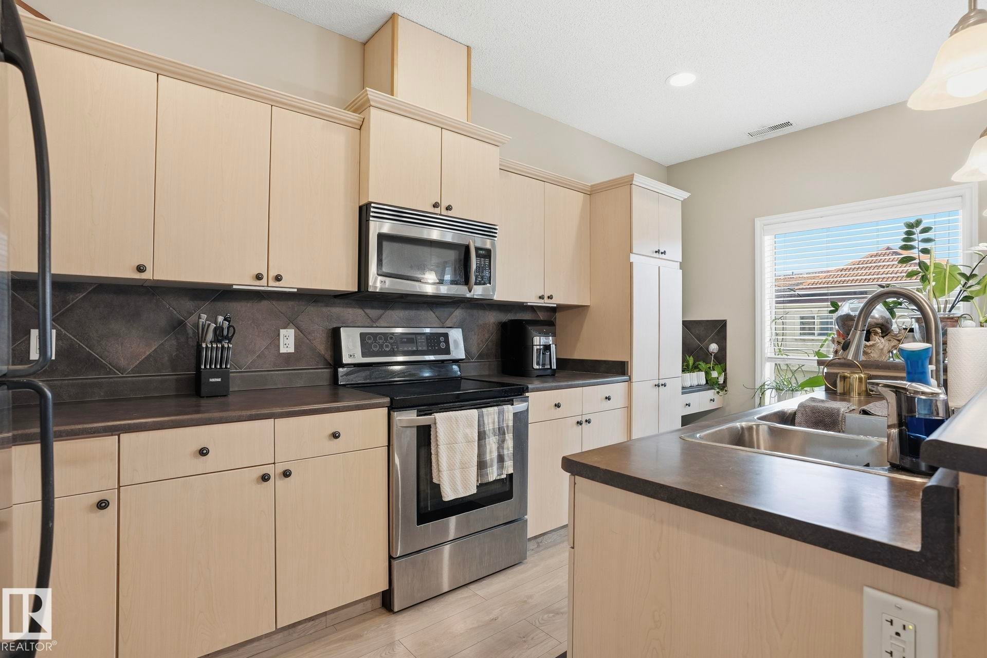 #52 13825 155 Av Nw, Edmonton, AB - Indoor Photo Showing Kitchen With Double Sink