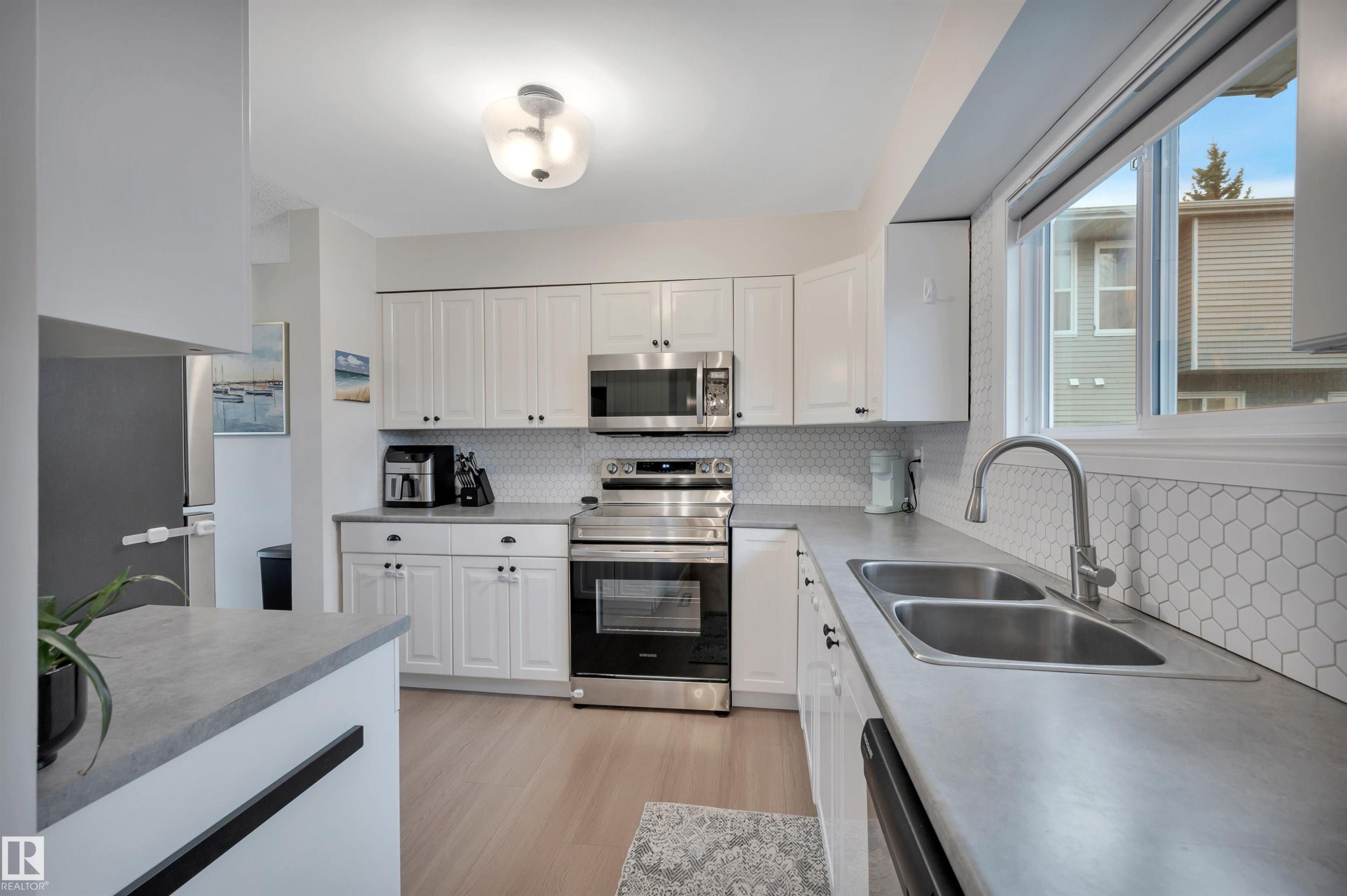 #35 4403 Riverbend Rd Nw, Edmonton, AB - Indoor Photo Showing Kitchen With Stainless Steel Kitchen With Double Sink