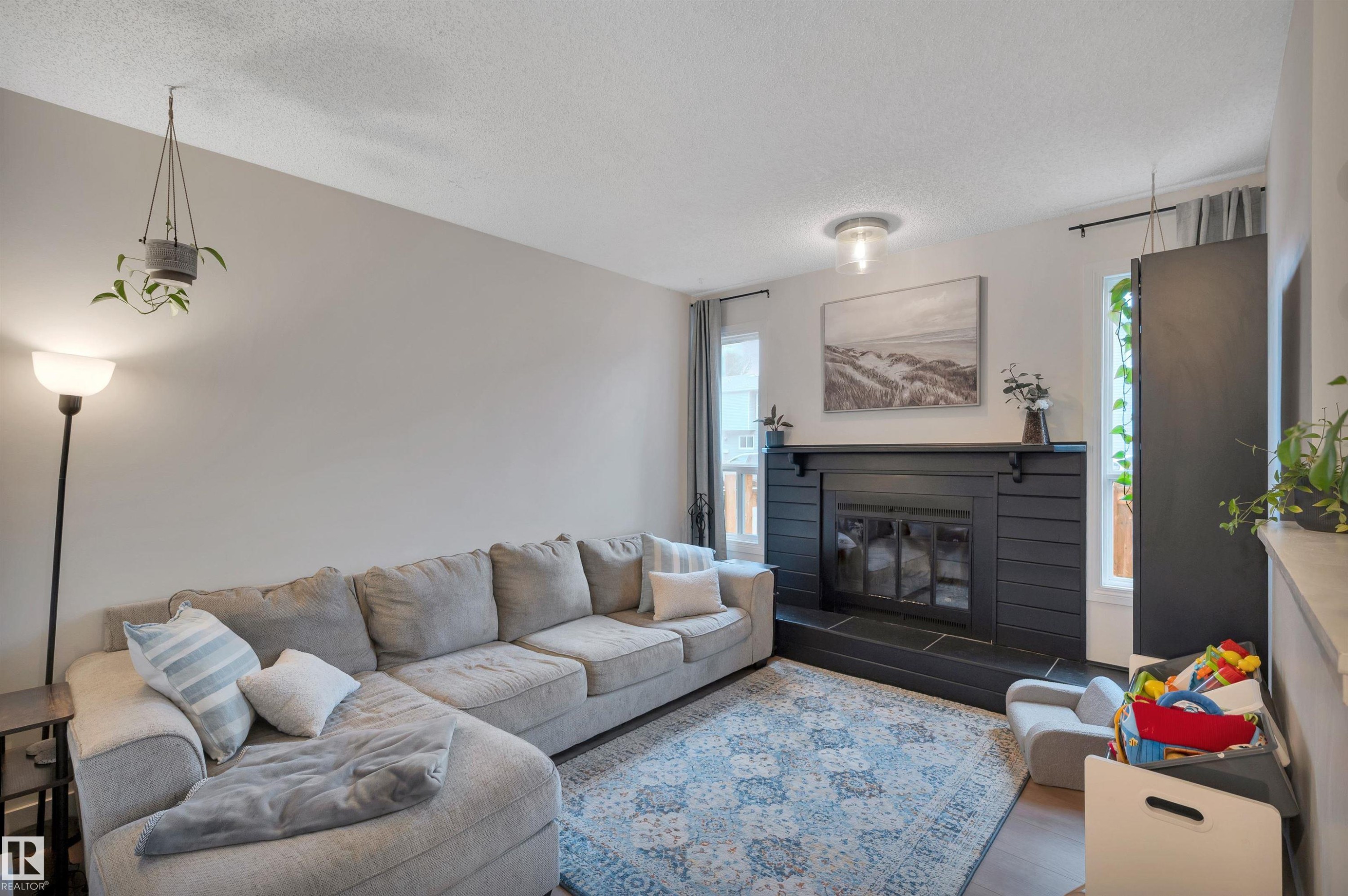 #35 4403 Riverbend Rd Nw, Edmonton, AB - Indoor Photo Showing Living Room With Fireplace