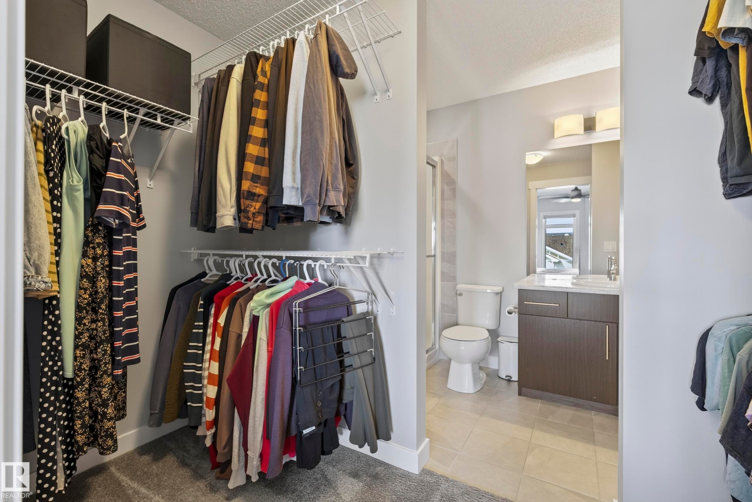 Walk-in closet with wire shelving and hanging rods - 45 Joyal Way, St. Albert, AB - Indoor With Storage