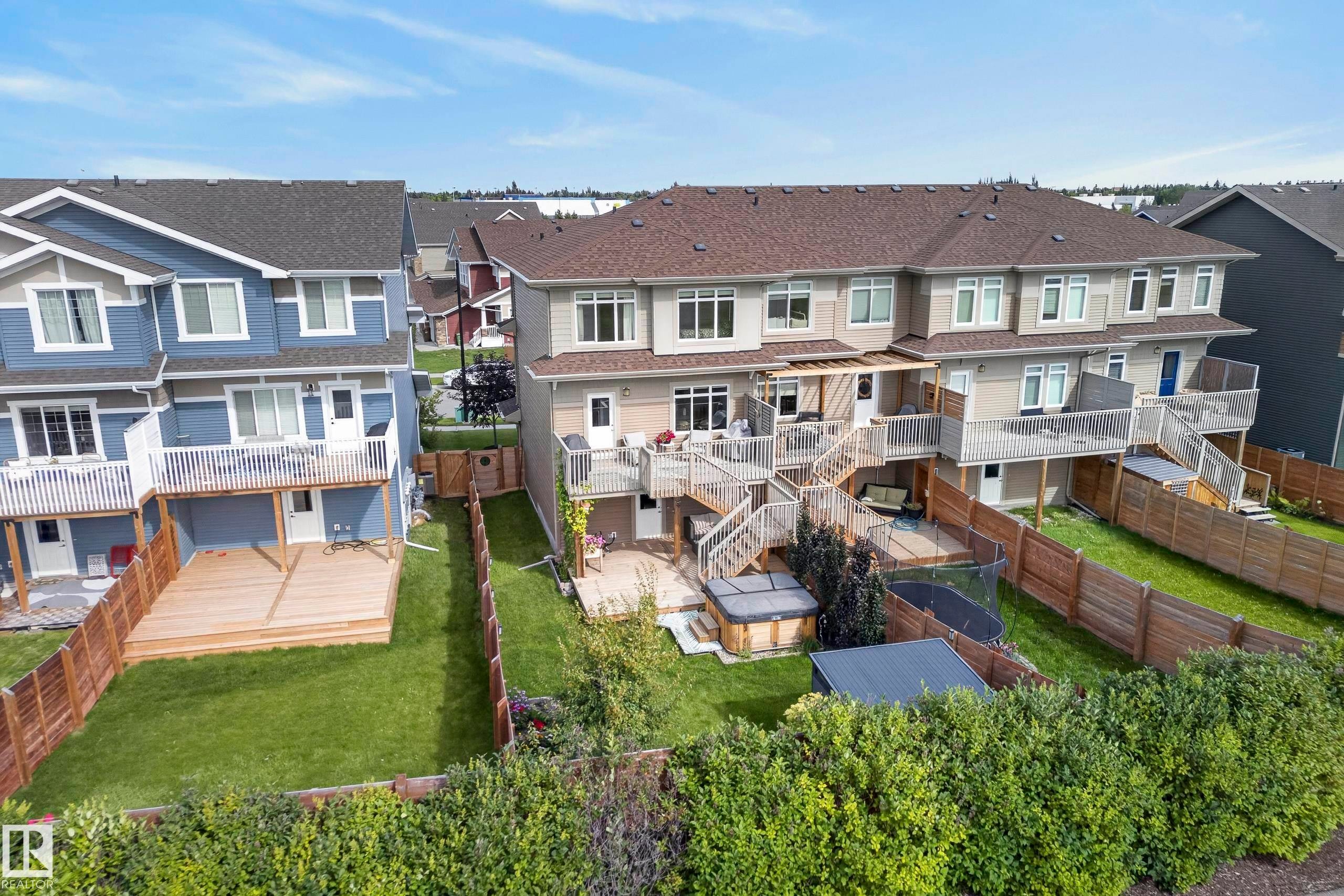 Townhome with multiple-level decking, private fenced yard, and exterior hot tub - 45 Joyal Way, St. Albert, AB - Outdoor