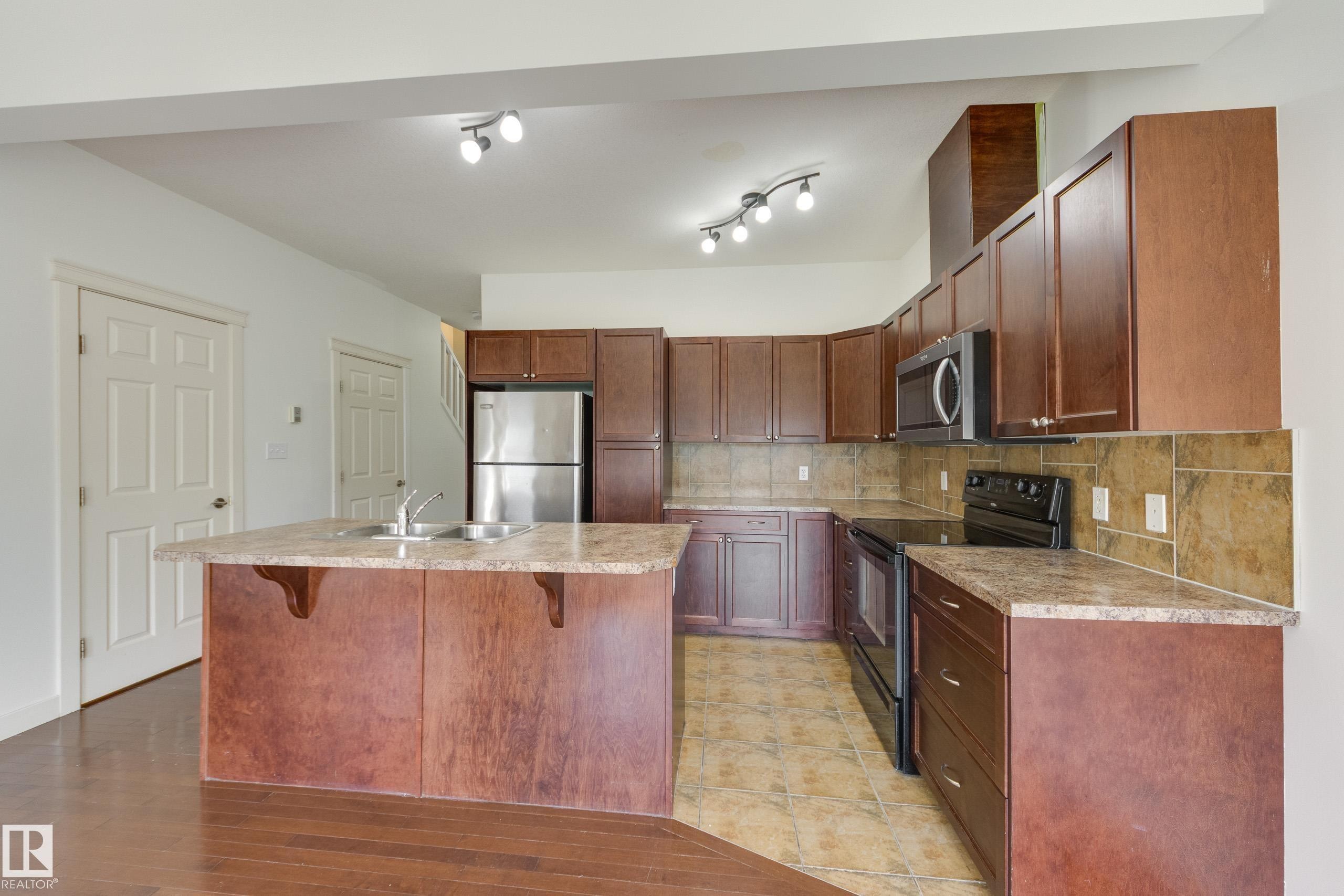 101 Sandstone Estates, Stony Plain, AB - Indoor Photo Showing Kitchen With Double Sink