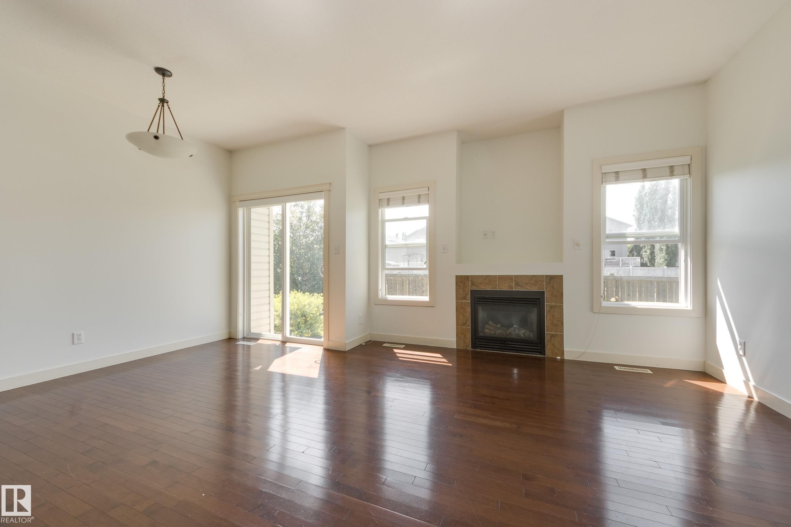101 Sandstone Estates, Stony Plain, AB - Indoor Photo Showing Living Room With Fireplace