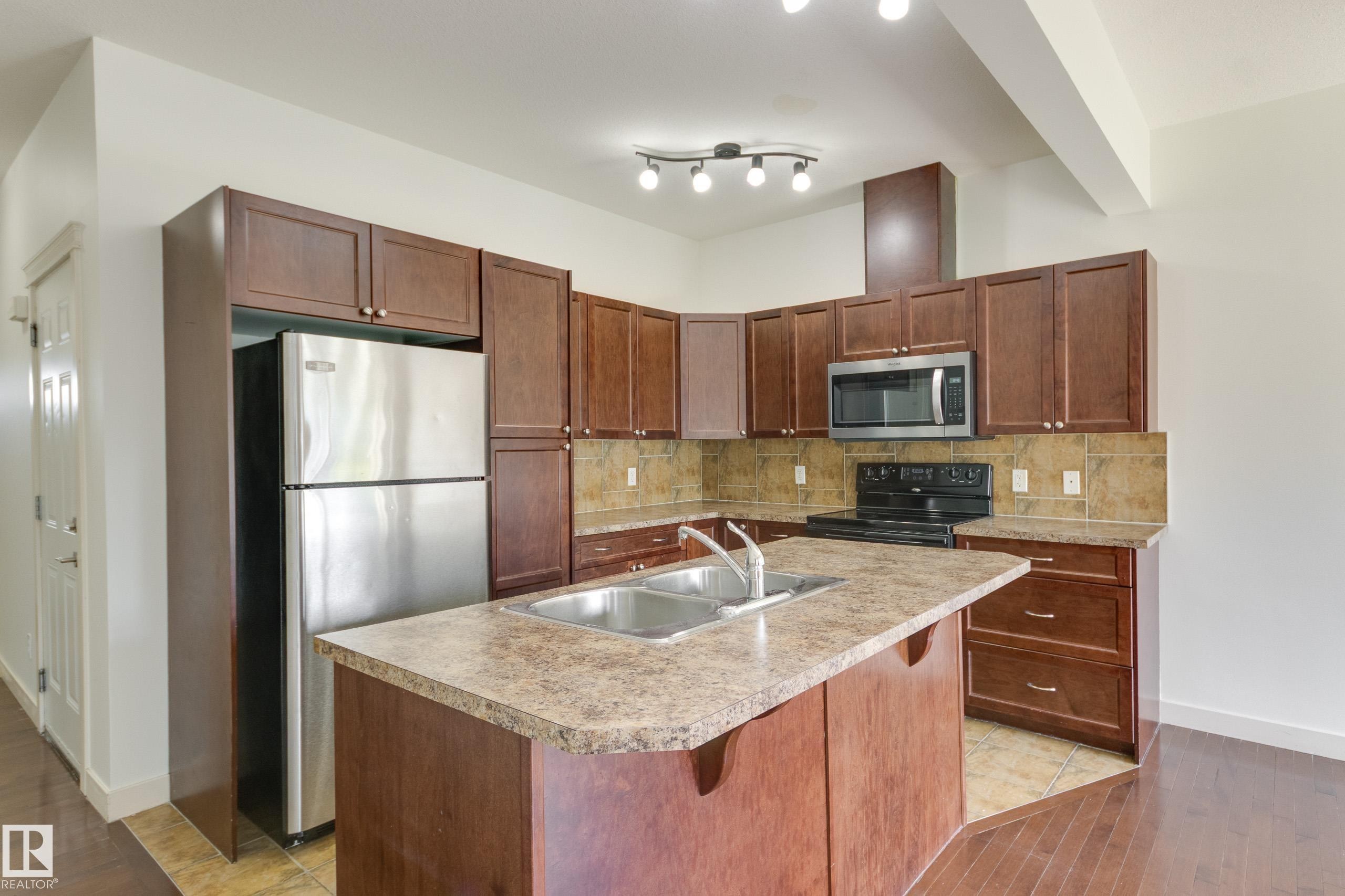101 Sandstone Estates, Stony Plain, AB - Indoor Photo Showing Kitchen With Double Sink