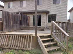 Multi-level wood deck with privacy fencing, and wood siding exterior -