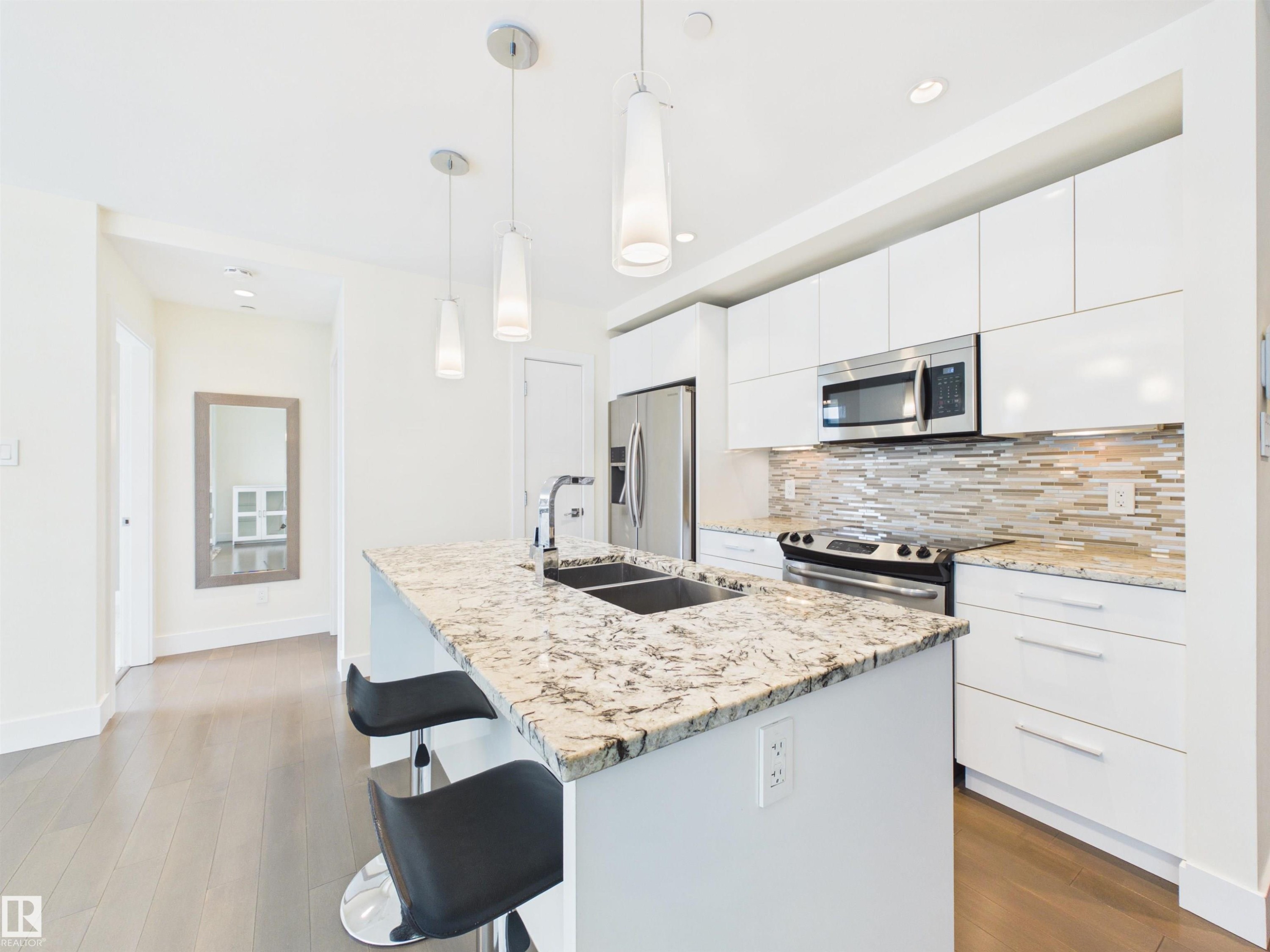 #307 11969 Jasper Av Nw, Edmonton, AB - Indoor Photo Showing Kitchen With Double Sink With Upgraded Kitchen