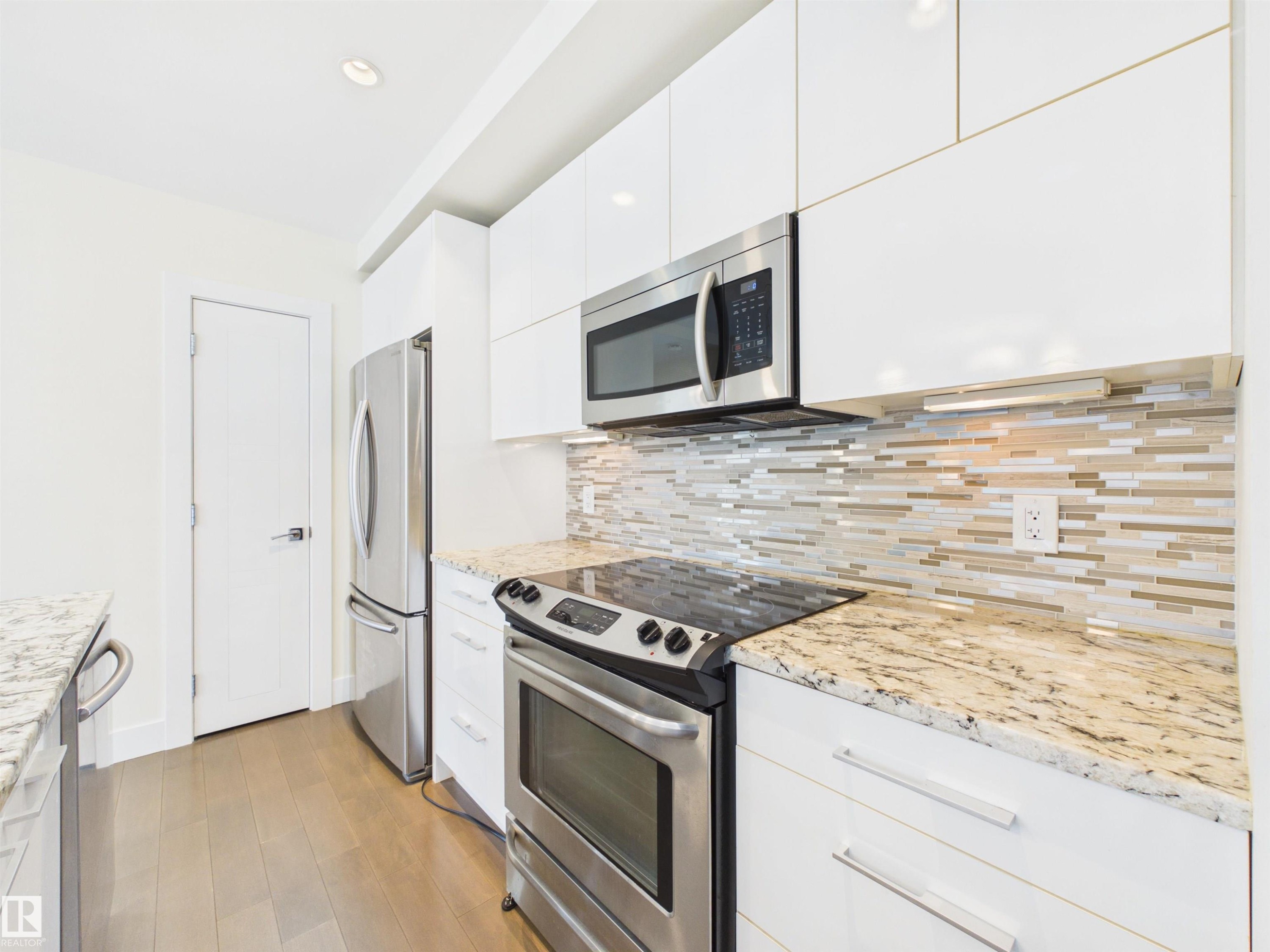#307 11969 Jasper Av Nw, Edmonton, AB - Indoor Photo Showing Kitchen With Upgraded Kitchen