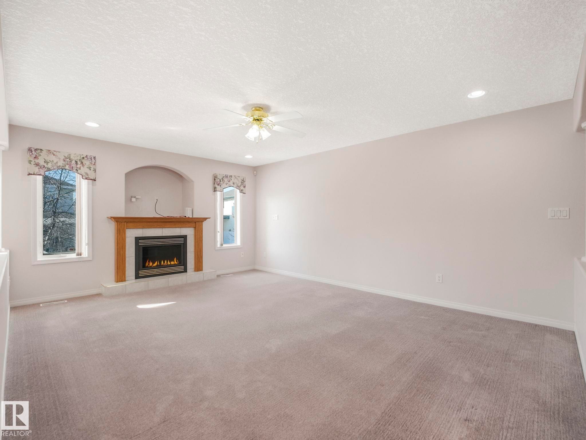 1054 Ormsby Crescent Nw, Edmonton, AB - Indoor Photo Showing Living Room With Fireplace