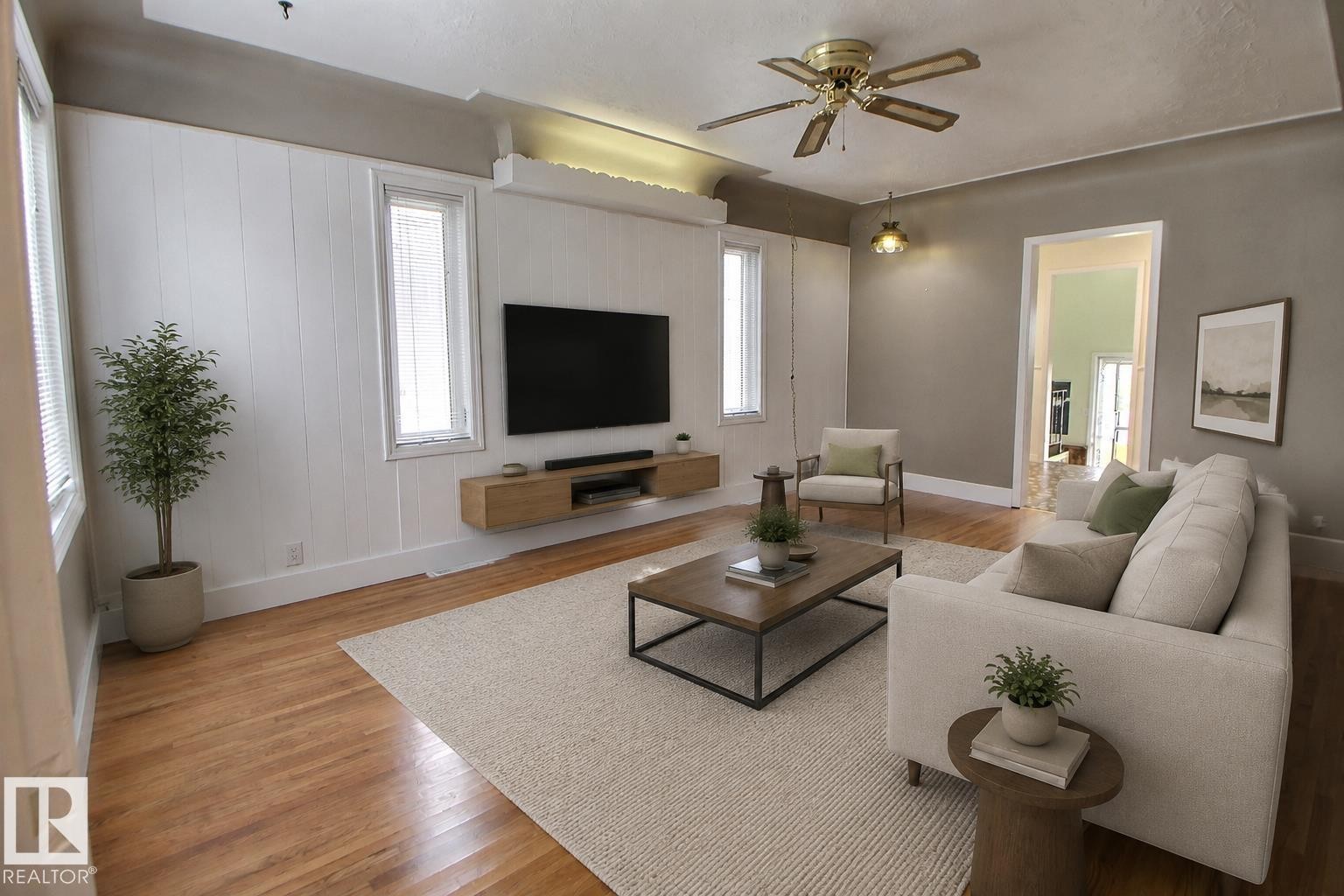 Hardwood flooring throughout, recessed ceiling with accent lighting, and a ceiling fan with integrated lighting - 11336 83 Street Nw, Edmonton, AB - Indoor Photo Showing Living Room