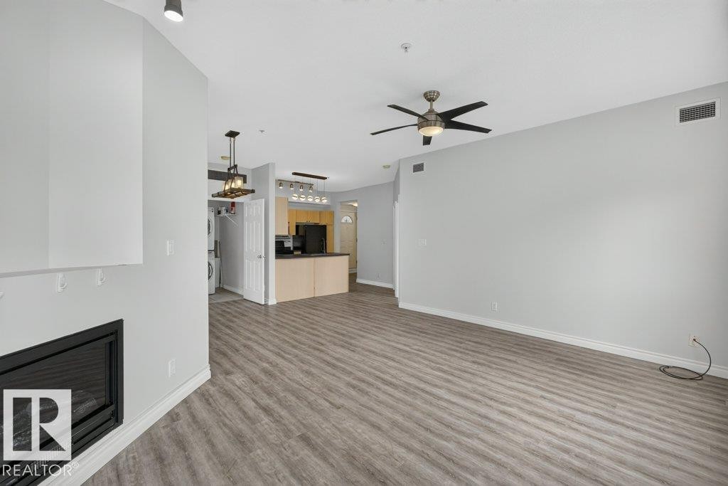 #207 10707 102 Av Nw, Edmonton, AB - Indoor With Fireplace