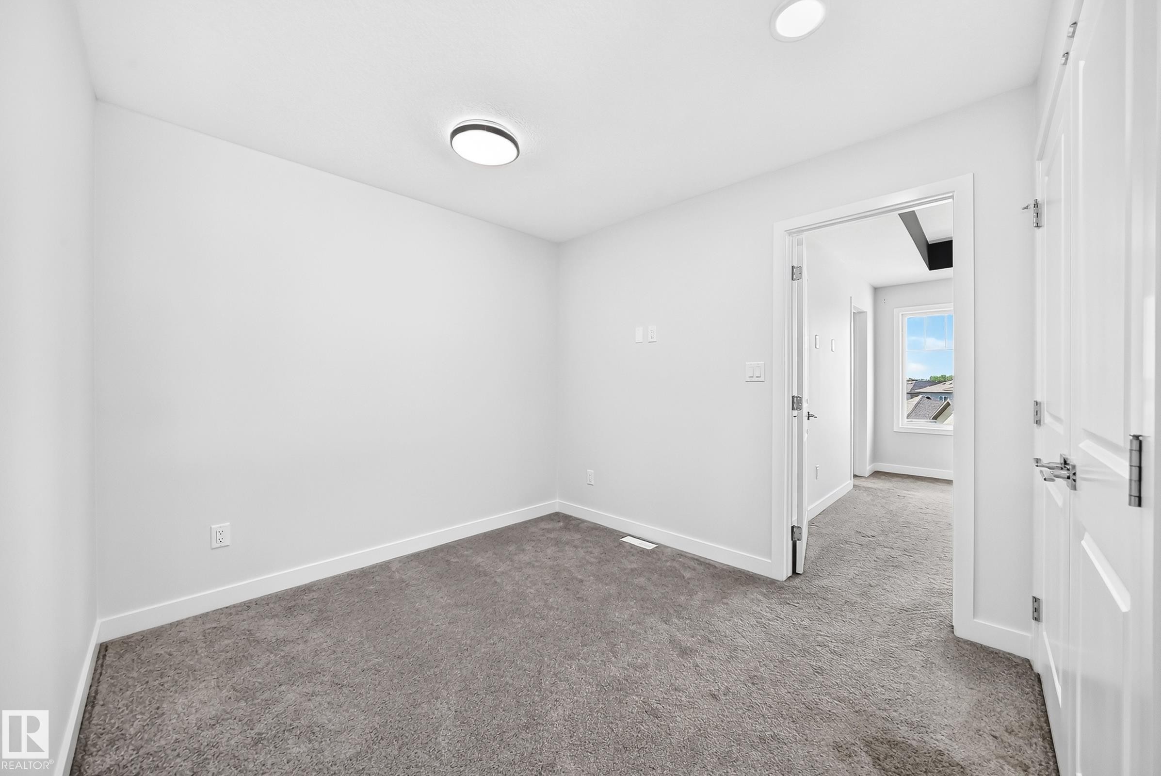 Neutral wall finishes, recessed ceiling lighting, and gray carpet flooring - 8823 Carson Way Sw, Edmonton, AB - Indoor Photo Showing Other Room