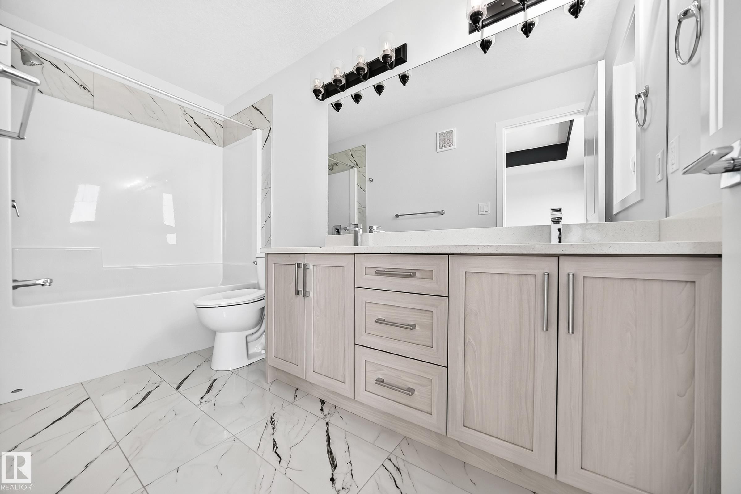 Dual vanity with light wood-finish cabinetry and brushed nickel hardware - 8823 Carson Way Sw, Edmonton, AB - Indoor Photo Showing Bathroom