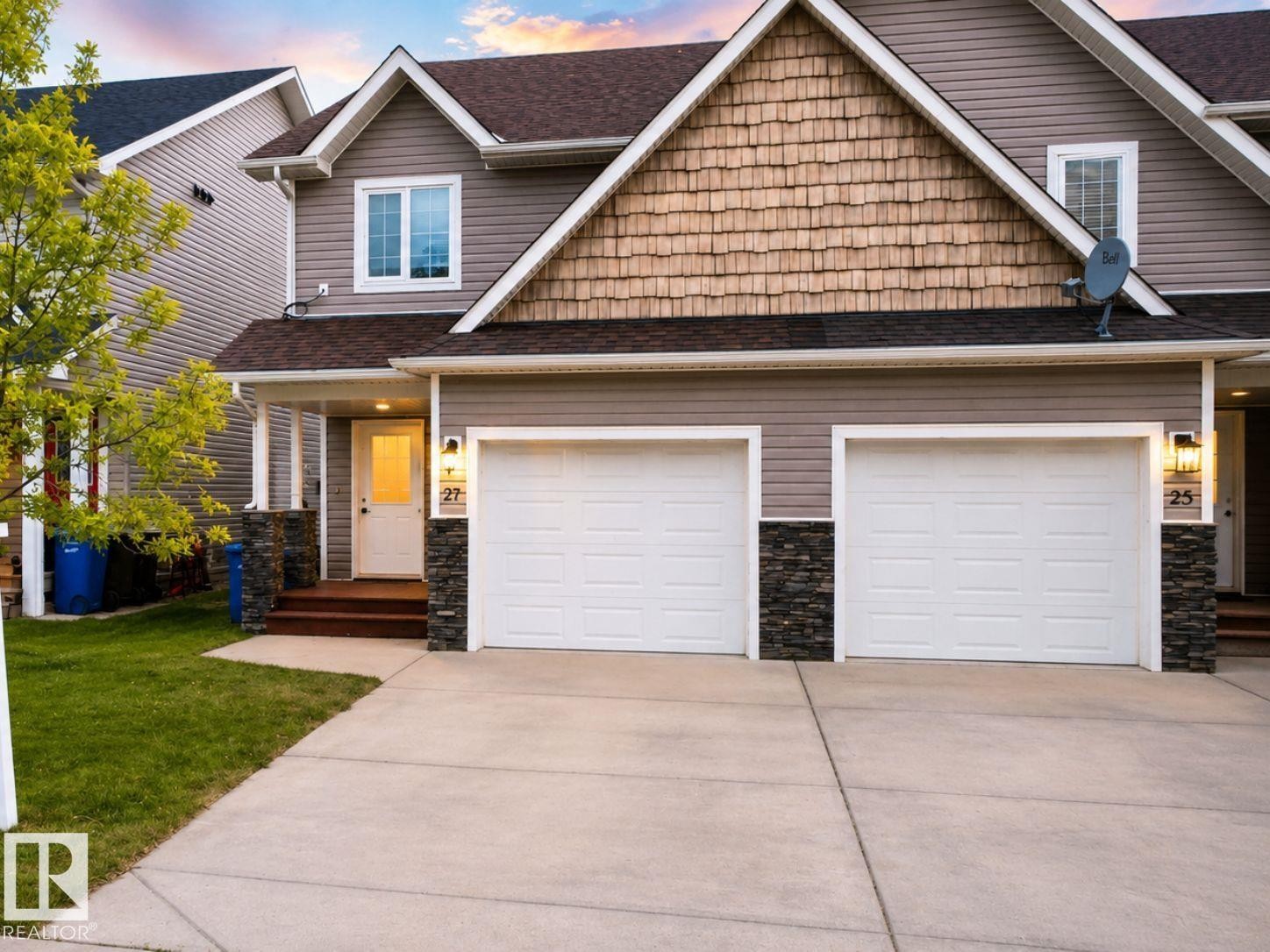 27 Deer Coulee Drive, Didsbury, AB - Outdoor With Facade