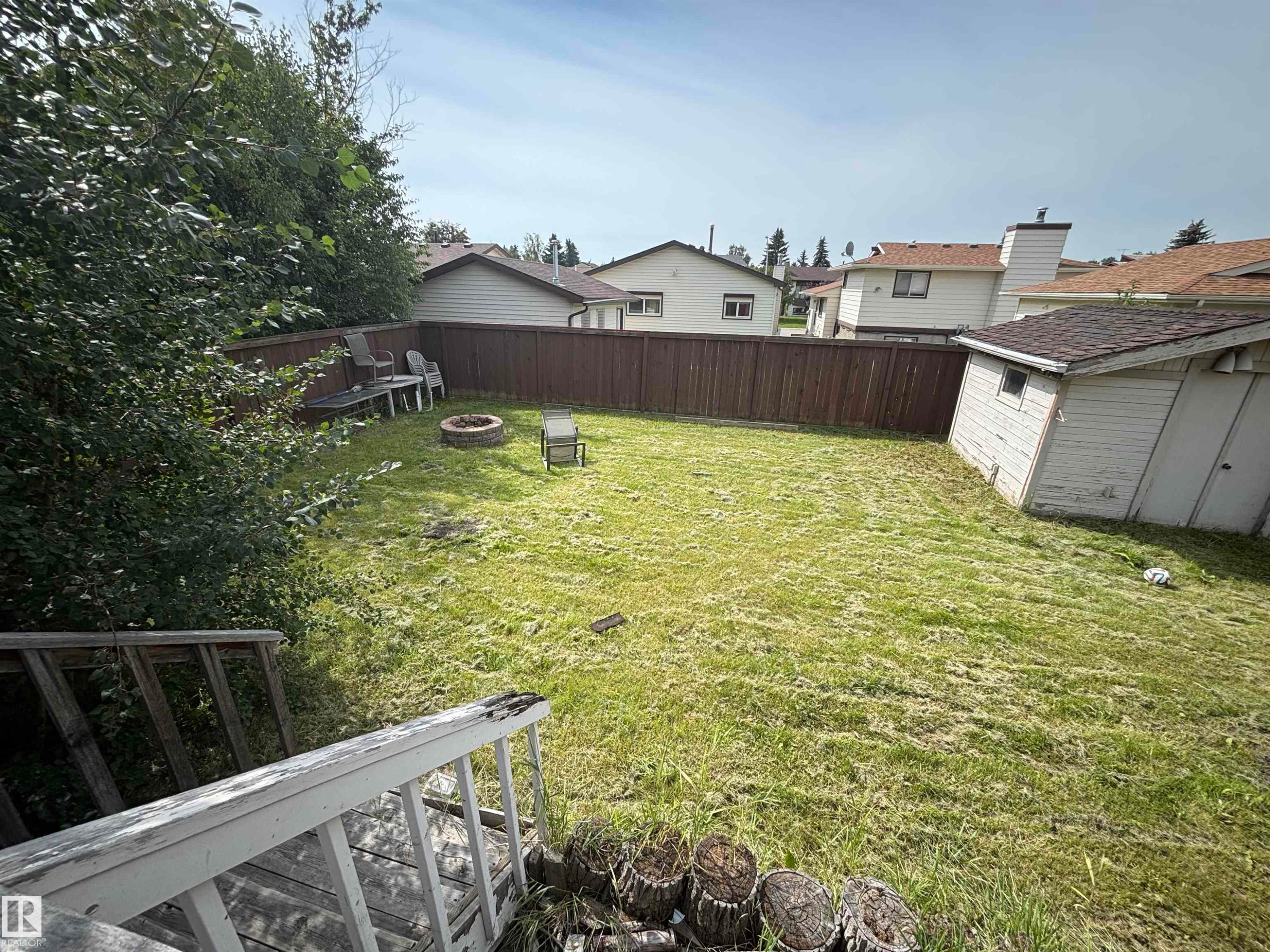 Expansive backyard featuring a fenced perimeter and a storage shed - 9223 172 Avenue Nw, Edmonton, AB