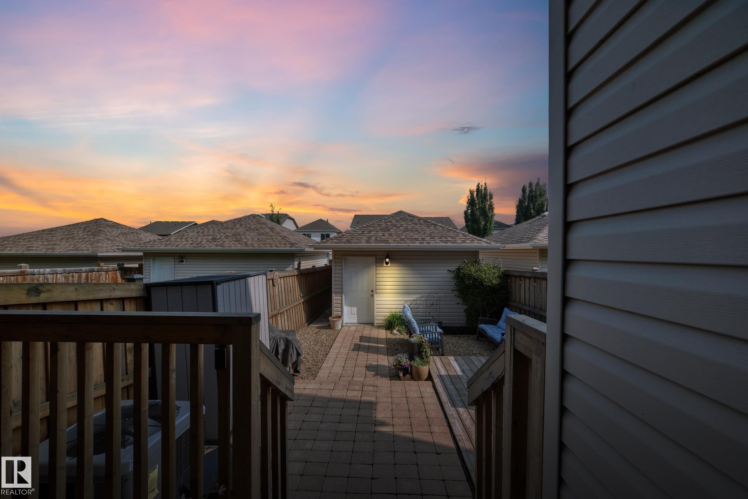 Backyard featuring a paver patio and wood deck - 466 Chappelle Drive Sw, Edmonton, AB - Outdoor With Deck Patio Veranda With Exterior