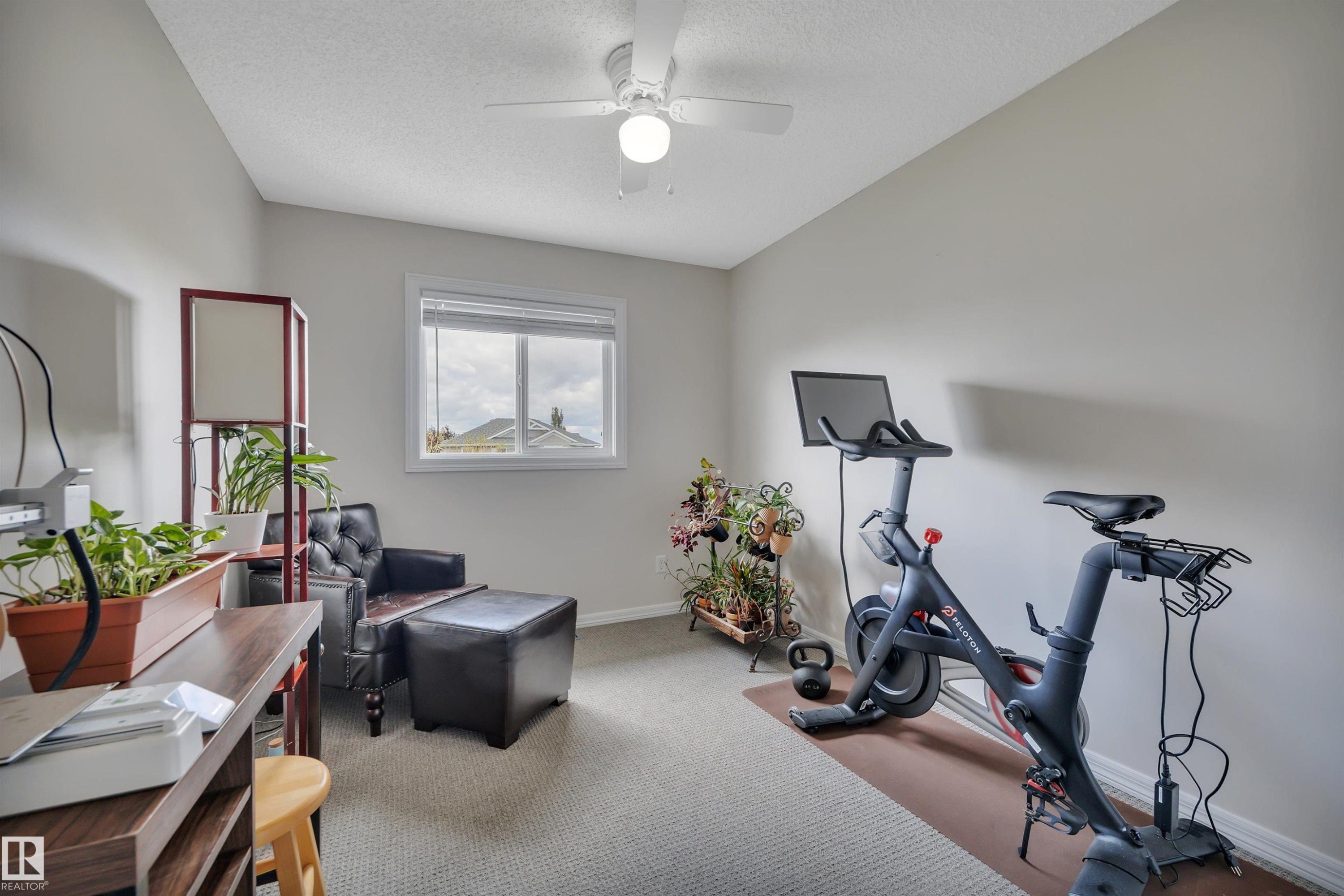 #49 5101 Soleil Bv, Beaumont, AB - Indoor Photo Showing Gym Room