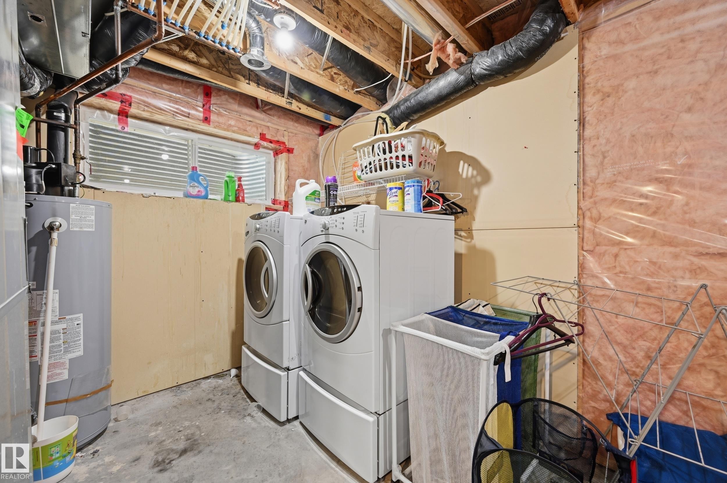 Laundry area in lower level - 1516 76 Street Sw, Edmonton, AB - Indoor Photo Showing Laundry Room