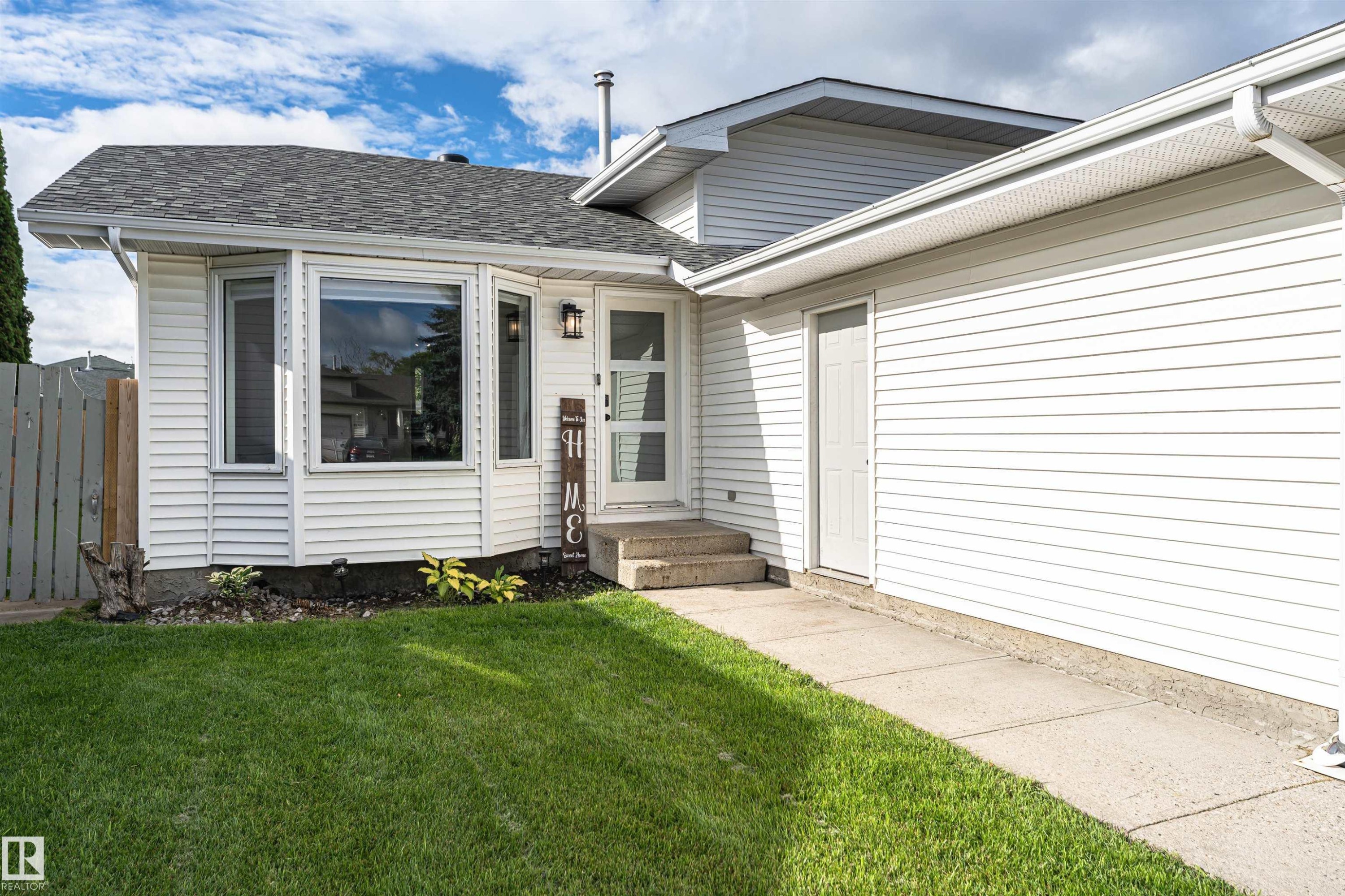 White siding exterior with a dark shingle roof - 4521 29 Avenue Nw, Edmonton, AB - Outdoor