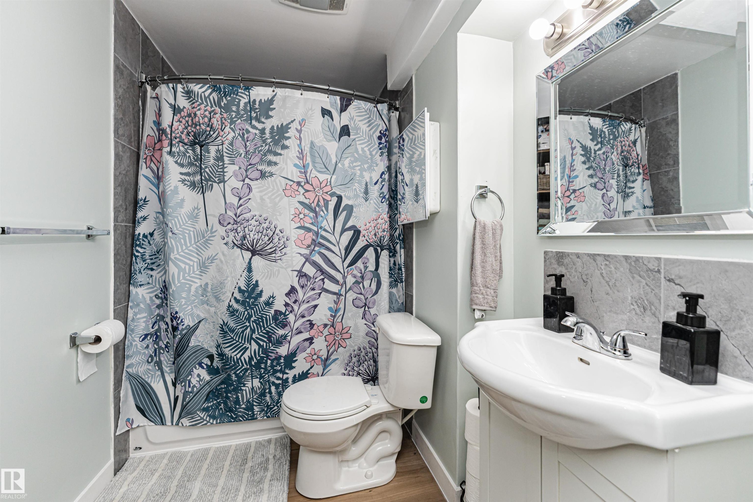 Built-in vanity with integrated sink, chrome faucet, and mirrored medicine cabinet - 4521 29 Avenue Nw, Edmonton, AB - Indoor Photo Showing Bathroom