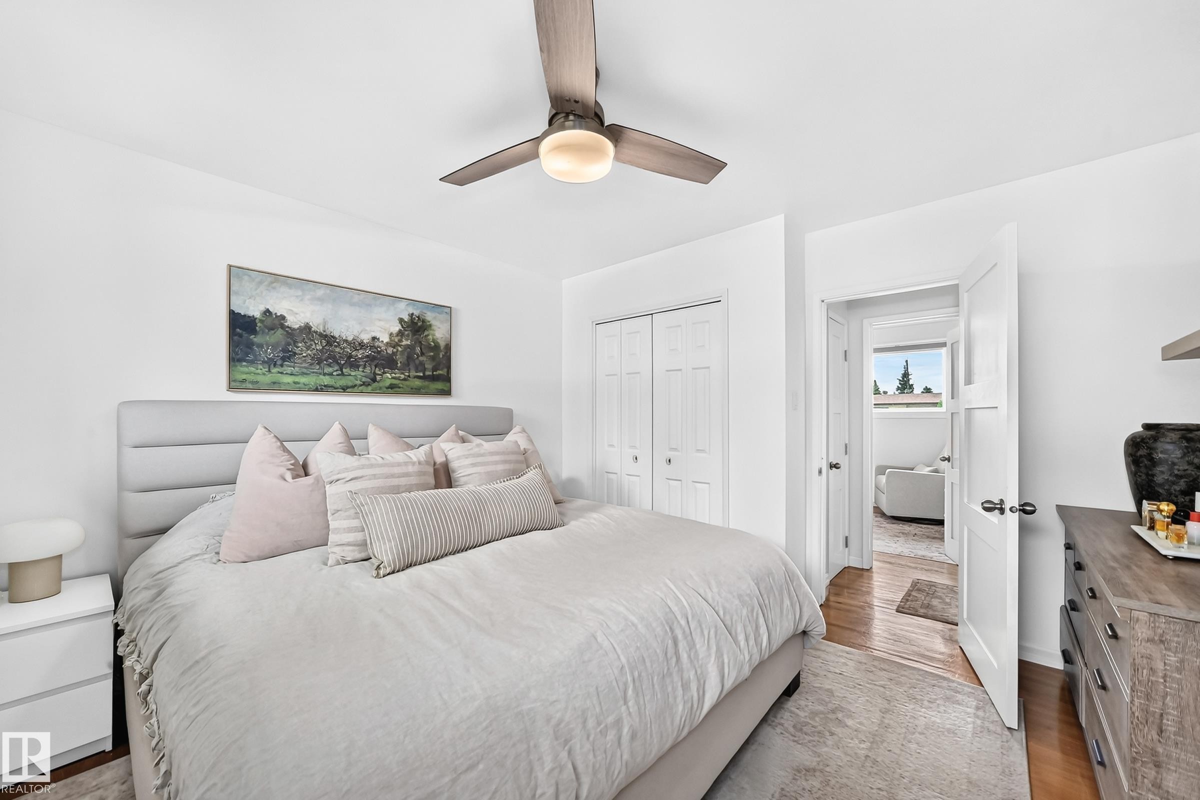 Recessed lighting, wood-finish flooring, white paneled doors, and a ceiling fan with integrated lighting - 16406 87A Avenue Nw, Edmonton, AB - Indoor Photo Showing Bedroom