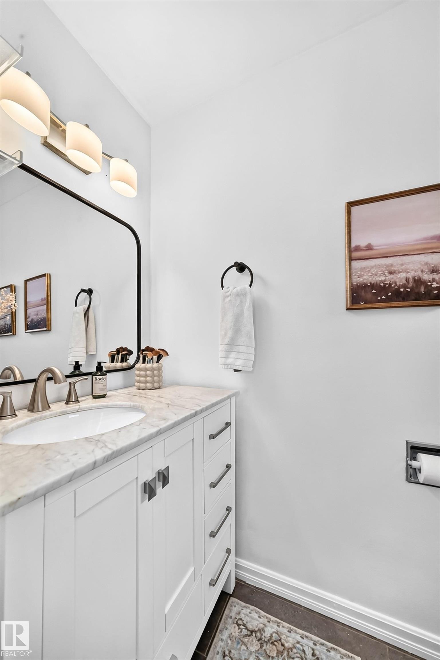 White vanity with a stone countertop and an undermount sink - 16406 87A Avenue Nw, Edmonton, AB - Indoor Photo Showing Bathroom