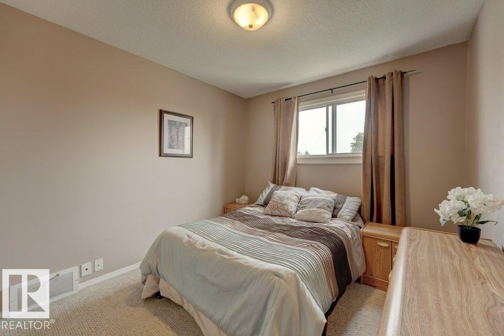 Wall-to-wall carpeting, neutral wall color, and overhead lighting - 307 Northgate Terrace Nw, Edmonton, AB - Indoor Photo Showing Bedroom