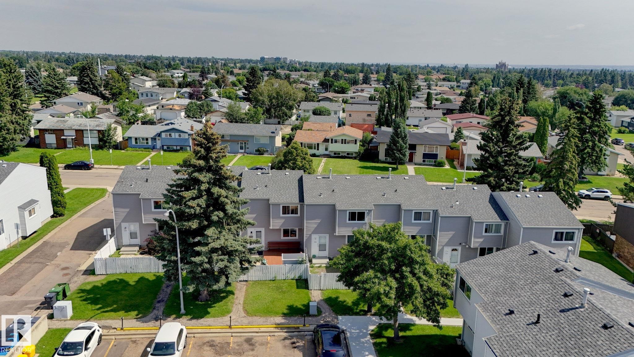Townhome property featuring grey siding and dark shingle roofing - 307 Northgate Terrace Nw, Edmonton, AB - Outdoor With View