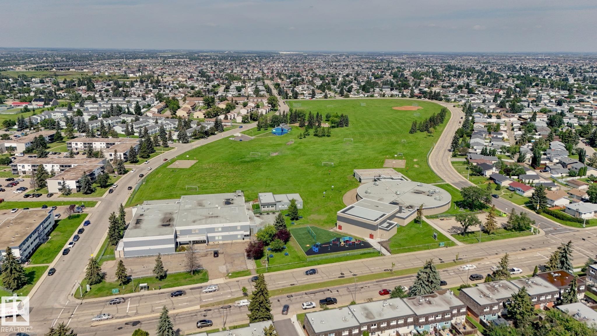 Expansive urban landscape featuring residential properties, roads, and a large central green space - 307 Northgate Terrace Nw, Edmonton, AB - Outdoor With View