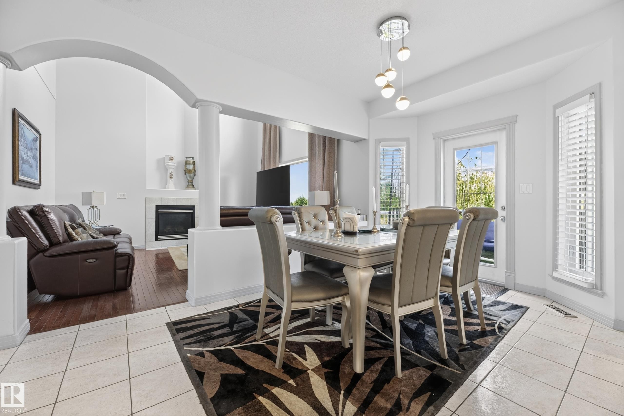 979 Hollingsworth Bend Nw, Edmonton, AB - Indoor Photo Showing Dining Room With Fireplace