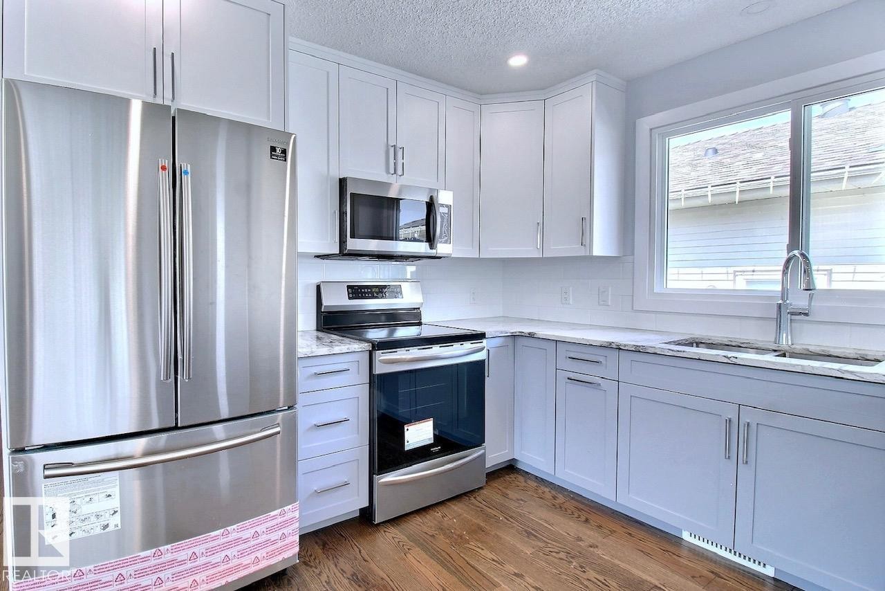 14732 32 Street Nw, Edmonton, AB - Indoor Photo Showing Kitchen With Double Sink